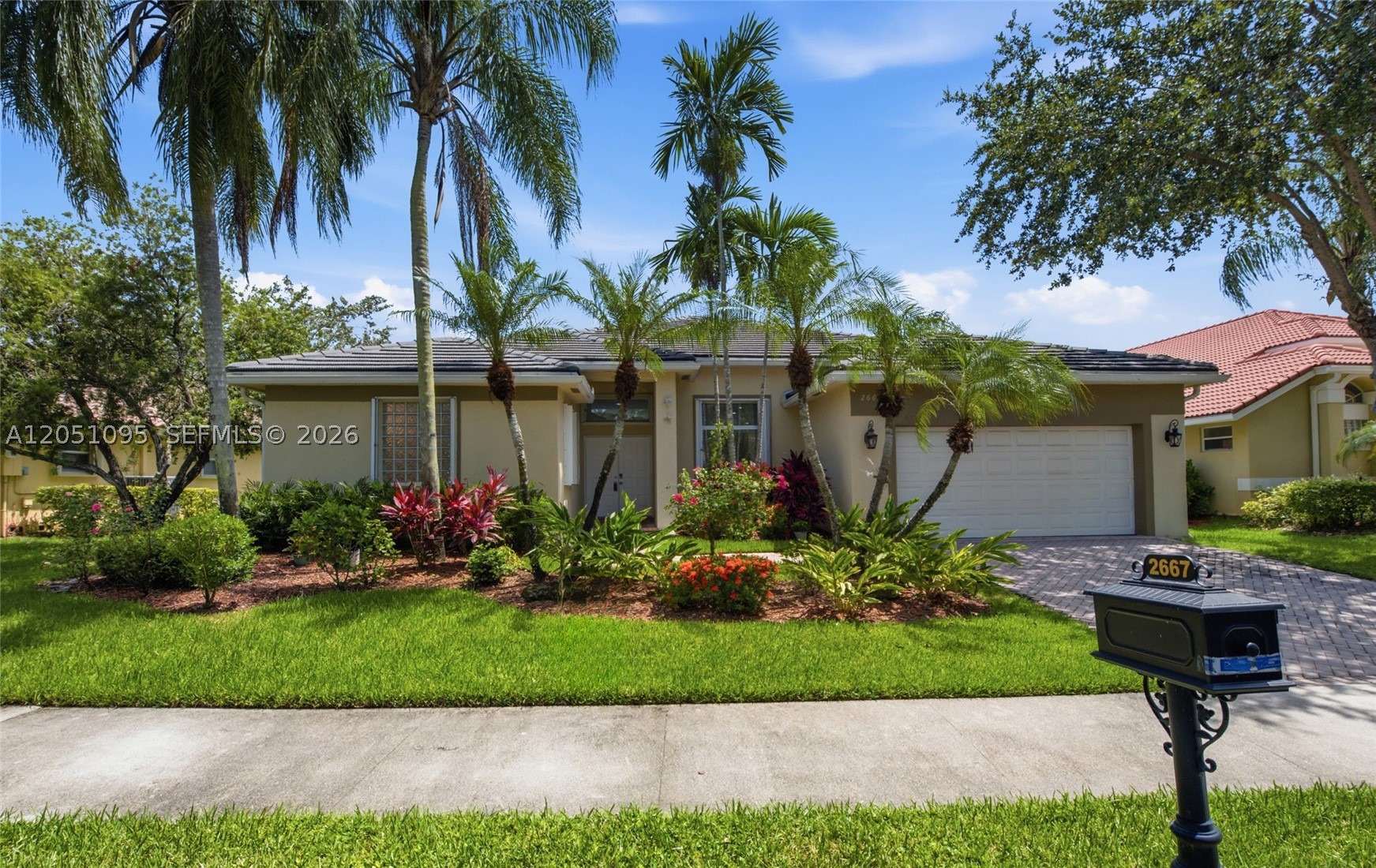 Nestled within the exclusive gated enclave of Grand Oaks in Weston Hills Country Club, this beautifully maintained one-story residence offers a desirable triple-split floor plan, soaring volume ceilings, and elegant marble flooring throughout. Filled with natural light, the home blends timeless design with thoughtful modern updates.
The renovated gourmet kitchen features crisp white cabinetry, quartz countertops with a dramatic waterfall edge, stainless steel appliances, a new refrigerator, electric range, microwave, exhaust fan, filtration system, and an instant hot-and-cold water dispenser. The spacious primary suite overlooks the private pool and offers high ceilings, two walk-in closets, and a spa-inspired bath with an oversized walk-in shower, Roman soaking tub, granite countertops, and marble flooring. Step outside to a fully fenced, lushly landscaped backyard with a freeform pool and a private setting for relaxing or entertaining. Additional upgrades include full accordion hurricane protection, a 2015 roof, 2018 A/C, 2019 water heater, a new pool pump, and a freshly painted garage floor. Recent community enhancements, including resurfaced streets, new sidewalks, and refreshed landscaping, are complete, and the seller has paid all assessments. Ideally located within walking distance of Weston Town Center and The Club at Weston Hills, this home offers the perfect blend of luxury, convenience, and the exceptional Weston lifestyle.
