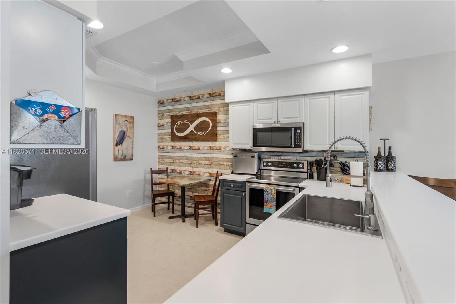 Boater’s dream condo with direct Gulf access and no bridges! Designed for the boater seeking a refined, low-maintenance lifestyle, this first-floor 3-bedroom, 2-bath residence includes a brand-new 10,000 lb boat lift (2024) and is located in the gated, waterfront Island Cove community in Cape Coral.

Positioned in highly desirable Building 10, this condo offers tranquil preserve and canal views and easy access to community amenities. Be on open water in minutes with a prime dock location near the ice machine, ideal for day trips, fishing, or sunset cruises.

The 1,330 sq ft open floor plan offers abundant natural light, generous closet space, and a private storage unit for boating gear. The owner’s suite features preserve and canal views, dual closets, and a walk-in shower. Guest bedrooms are located at the front for privacy.

The kitchen features stainless steel appliances, a large pantry, and designer accent wall. Indoor laundry with cabinetry and washer/dryer adds convenience. Enjoy peaceful outdoor living from the screened lanai.

Island Cove is a gated, pet-friendly, socially active waterfront community with a heated pool and spa, pickleball and tennis courts.

Recent upgrades: New dock, electric & 10K boat lift (2024); impact-rated windows, sliders and doors; all new appliances (2020); new ceiling fans; garbage disposal (2021); brand-new lanai screens (2025).

Seller offering a 1% interest rate buy-down with preferred lender. Virtual tour available.