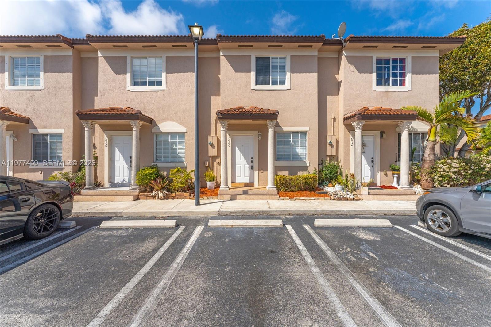 Beautifully maintained 2/2.5 townhome. Recently painted throughout. Tile floors downstairs and wood laminate upstairs. BRAND NEW CENTRAL AC UNIT. Kitchen appliances relatively new. Great patio area with NO REAR NIEGHBOR makes it feel much more open. Also has an outside storage unit. Convenient parking right in front of the property. Two assigned parking spots.