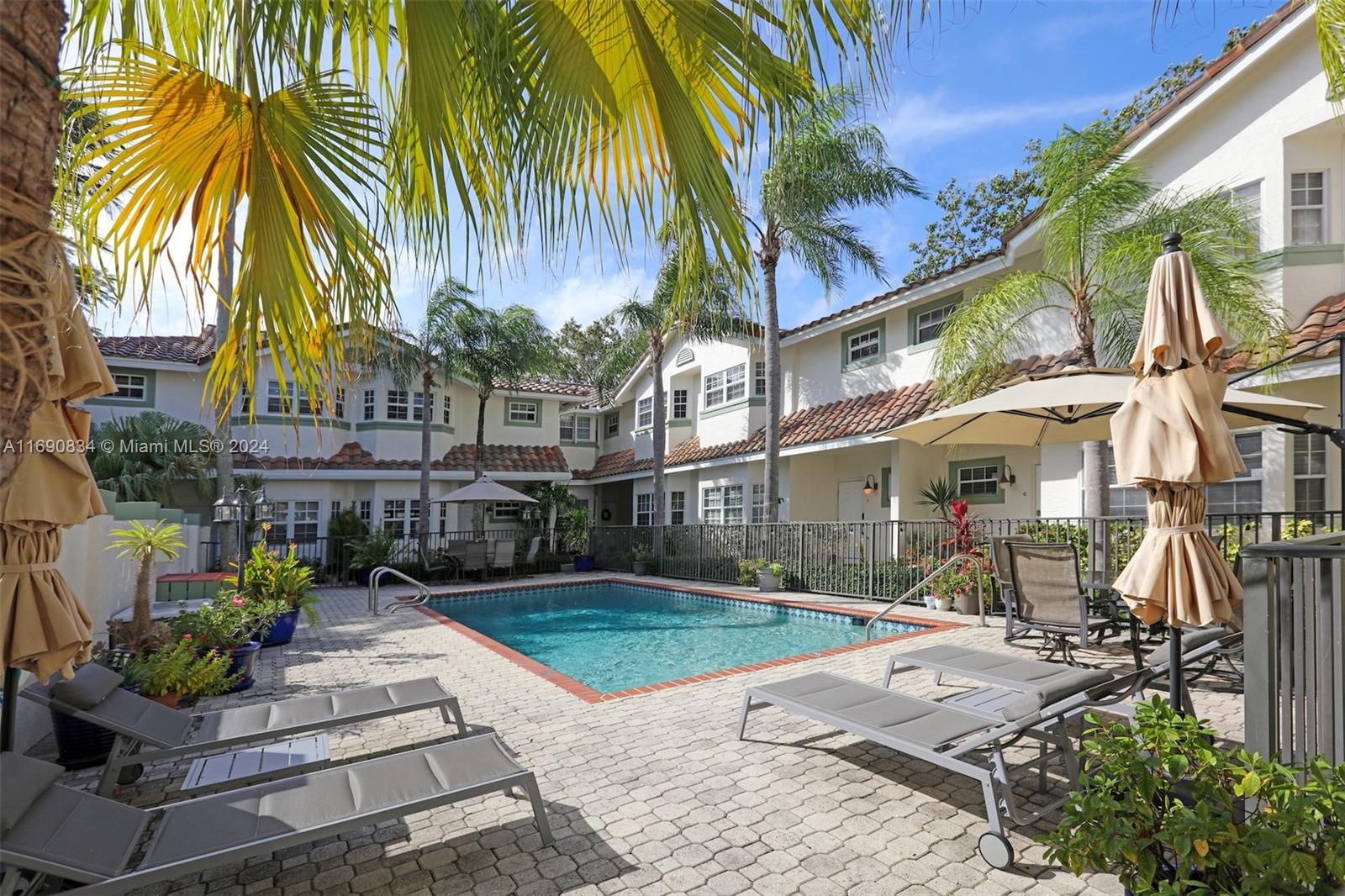 Beautifully remodeled 2BR/2.5BA, 1292 Sq Ft Victoria Park Townhouse Condo only a few steps from the new Panthers Iceplex, Holiday Park and Parker Playhouse.  This updated gem features a wide open living area with stainless steel appliances, foyer entry, upgraded kitchen, half bath and master bath.  Tile and Bamboo floors throughout the unit with an ideal split 2nd floor plan with two master suites, each with a custom built walk-in closet.  The unit boasts a large brick-paved private terrace with lush landscape throughout the complex and center pool.  Downtown and the Beach also a few minutes away!