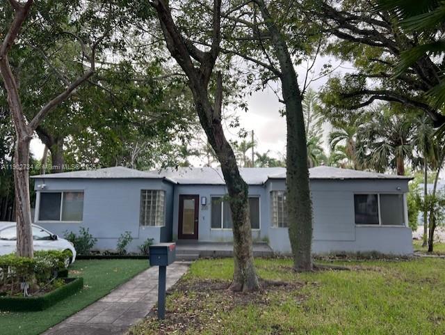 The Design District is just a few steps away from this house, nestled in a quiet area to relax and work. Enjoy Miami in a neighborhood renowned for its historic homes and proximity to world-class brands. Innovators, artists, will find world top brands as well as upscale home goods, fashion, and accessories. This fully renovated home features 4 bedrooms, 2 bathrooms, a social area with an open layout, and two doors to exit to the patio. Everything is new—windows, kitchen, bathrooms, roof, flooring, and fixtures. The area boasts an extraordinary food scene. Miami’s fashion, design, and arts, while living and working in a peaceful setting,