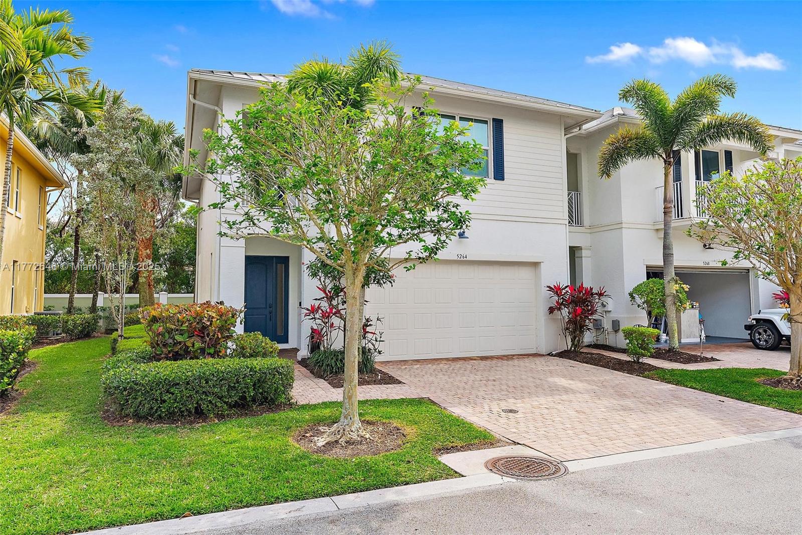This 3-bedroom, 2.5-bath, 2-car garage corner unit offers an open-concept floor plan with ALL impact glass & plenty of natural light. The kitchen features a granite island, large pantry, & brand-new stainless steel appliances. The spacious living area is perfect for entertaining, while the private screened-in porch lets you enjoy the outdoors year-round. Upstairs, the primary suite has a walk-in closet, an extra-large closet, & a private balcony. The ensuite bath includes dual sinks, a soaking tub, a separate shower, & a roomy linen closet. Updates include a new hot water heater, AC (3 years old), & new carpeting. Blinds, curtains, & plantation shutters add the perfect finishing touch.