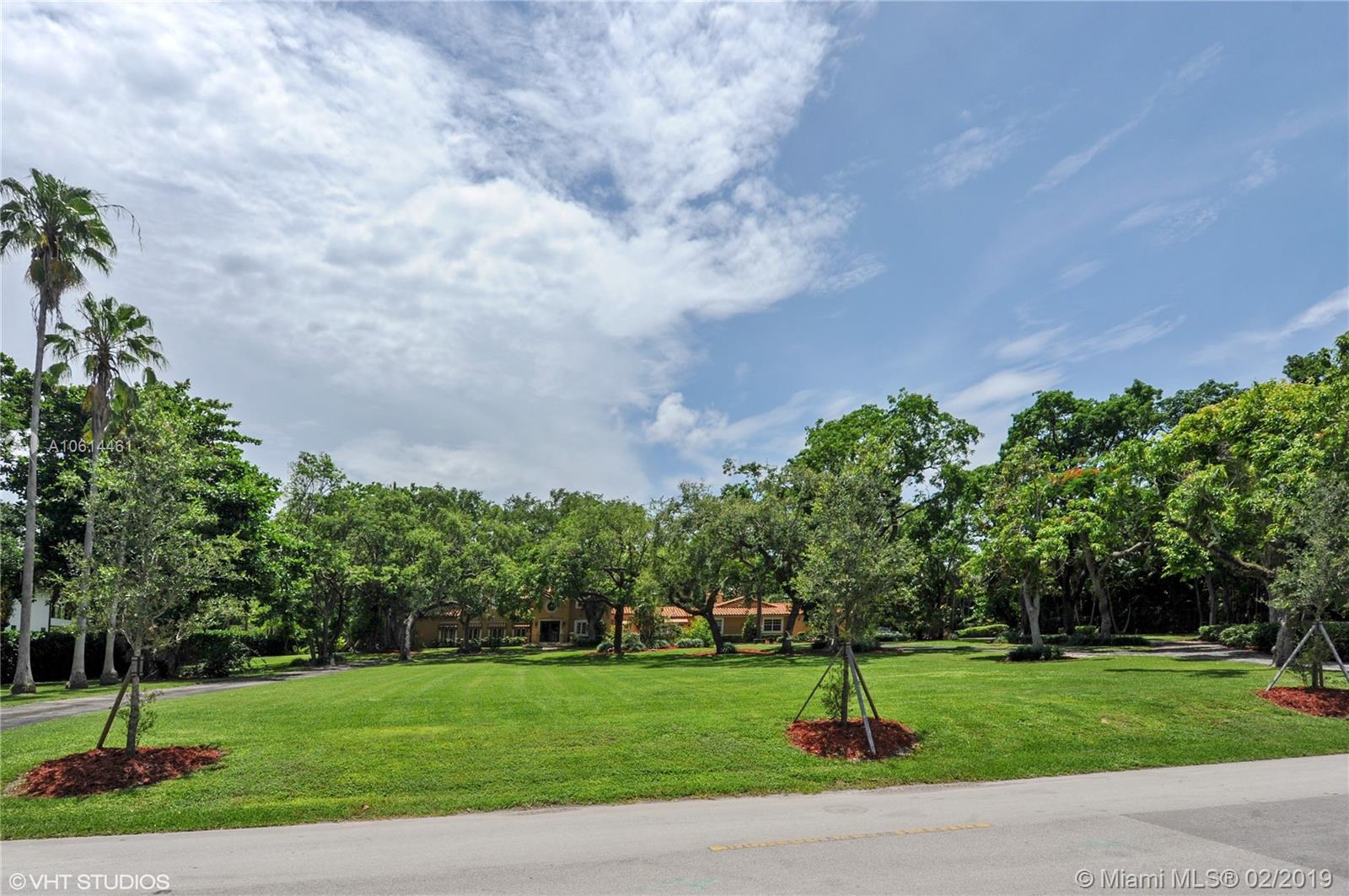 Spectacular, beautifully landscaped 87,464 sq ft lot in exclusive Gables Estates. There is presently a 6 bedroom 6.5 bath Old Spanish home on the land which one could renovate or build a new home on the land.