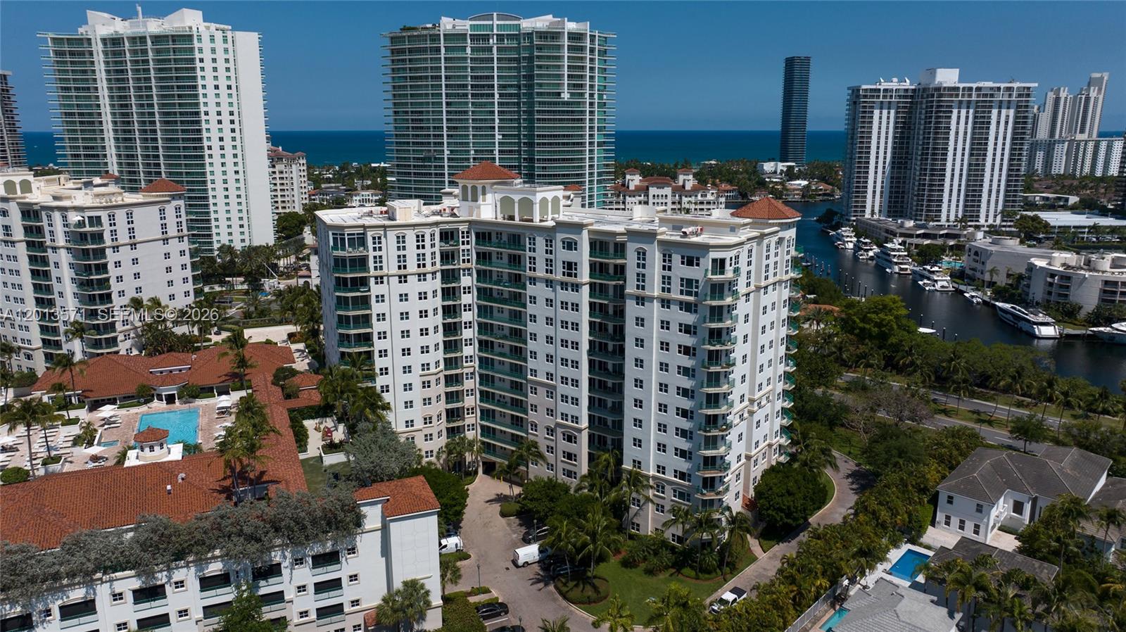 Luxury full-service living in the heart of Aventura, ideally situated along the prestigious Turnberry Isle Golf Course. This bright and spacious 2-bedroom, 2-bath residence features soaring 14-foot ceilings and elegant marble floors throughout, creating an open and airy feel. Desirable first-floor location offers effortless access and a true townhouse-style feel, perfect for convenient everyday living and easy indoor-outdoor flow. The modern kitchen is designed with sleek Snaidero cabinetry and granite countertops, offering both style and functionality. Bathrooms are tastefully finished with a clean, sophisticated design. Enjoy resort-style amenities including two pools, jacuzzi spa, state-of-the-art fitness center, racquetball court, and children’s play area. Step outside to direct access to scenic walking, jogging, and biking paths surrounding the golf course. Located within the exclusive circle of the JW Marriott Miami Turnberry Resort & Spa, and just minutes from Aventura Mall, fine dining, and a short drive to the beach. Walking distance to places of worship.