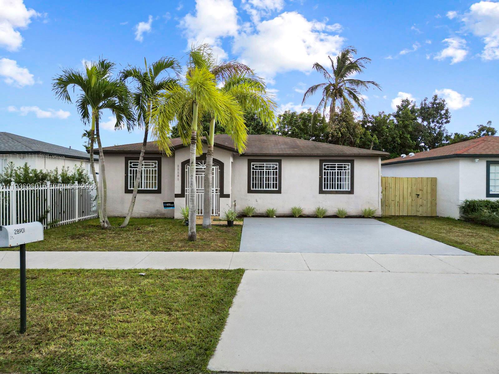 Discover the perfect blend of comfort and convenience in this charming 3-bedroom, 2-bathroom residence now available. This home is perfect for a growing family or those who love to entertain and enjoying the Florida sunshine. The kitchen features beautiful tile counters and white appliances, while the tile flooring throughout adds a touch of elegance. Located near parks, schools, the Florida turnpike, shopping centers, and hospital convenience is at your fingertips. With no HOA fees, you have the freedom to make this home your own. The spacious driveway and covered patio provide ample space for parking and outdoor gatherings. Don't miss out on this incredible opportunity to own a piece of paradise in Homestead!