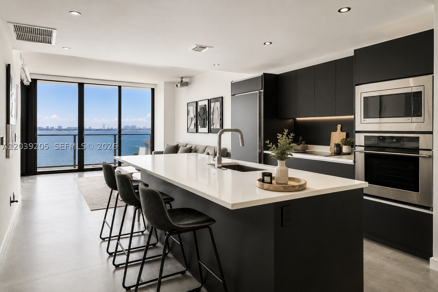 Beautifully renovated 2-bedroom residence offered fully furnished and turn-key in the heart of Edgewater. Wake up to breathtaking sunrises and direct water views through an expansive wall of glass, with floor-to-ceiling windows filling the home with natural light throughout the day. A sliding privacy shade adds comfort and discretion when desired. Enter through a private elevator foyer into a thoughtfully designed split floor plan featuring an open-concept kitchen, modern appliances, custom closets, new lighting, and refined finishes throughout. The living and dining areas flow seamlessly, creating an elegant setting for both everyday living and entertaining, complete with a projector for a movie-style experience at home. Enjoy resort-style amenities including a waterfront pool, tennis courts, spa, fitness center, theater, clubroom, sky lounge, and more. Located in one of Miami’s most desirable waterfront neighborhoods, just one block from Whole Foods and minutes from Wynwood, the Design District, Midtown, Brickell, Miami Beach, top dining, shopping, and cultural destinations. Just minutes from the airport, this turn-key residence offers a sophisticated waterfront lifestyle defined by comfort, convenience, and effortless Miami luxury.