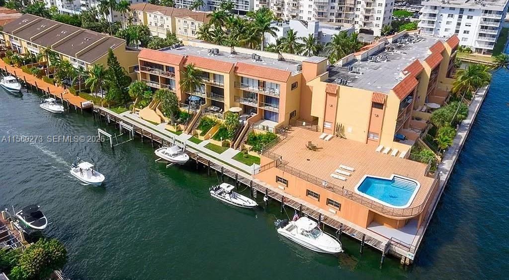 One of the kind, rare opportunity for a beautiful and spacious waterfront Townhome, 2 bed 3 bath with beautiful direct view of Intracoastal and Sunny Isles Beach skyline. Features: Spacious primary bedroom custom closet, open kitchen, new appliances, updated bathrooms, AC, new washer & dryer in the unit, motorized blinds , balcony in each room w/ views. Renovated pool, meeting room and Gym. Just minutes to Sunny Isles Beach. Building has 3 story 24-units , underground private parking 2 per unit with storage and plenty of guest parking. Building in a "Cul-de-Sac", with gated access and water views on all three sides, Seller has paid $50k assessment ! Perfect time to move into this perfect coastal charm of waterfront living.