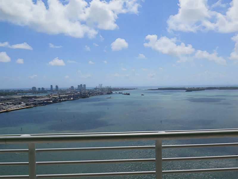 Best Line in the Building! Breathtaking water views from all rooms, wraparound balcony, SS appliances, granite countertop & 2 TANDEM PARKING SPACES! 2nd bedroom opens to living room with double doors. Marble floors in common areas including balcony & also  in 2nd bedroom. Amazing location, do everything by foot! Walking distance to Whole Foods, Bayfront Park, AA arena & Brickell! Close to the I-95 entrance! VACANT & very easy to show with agent/owner on site! Unit was just painted completely in off-white!
