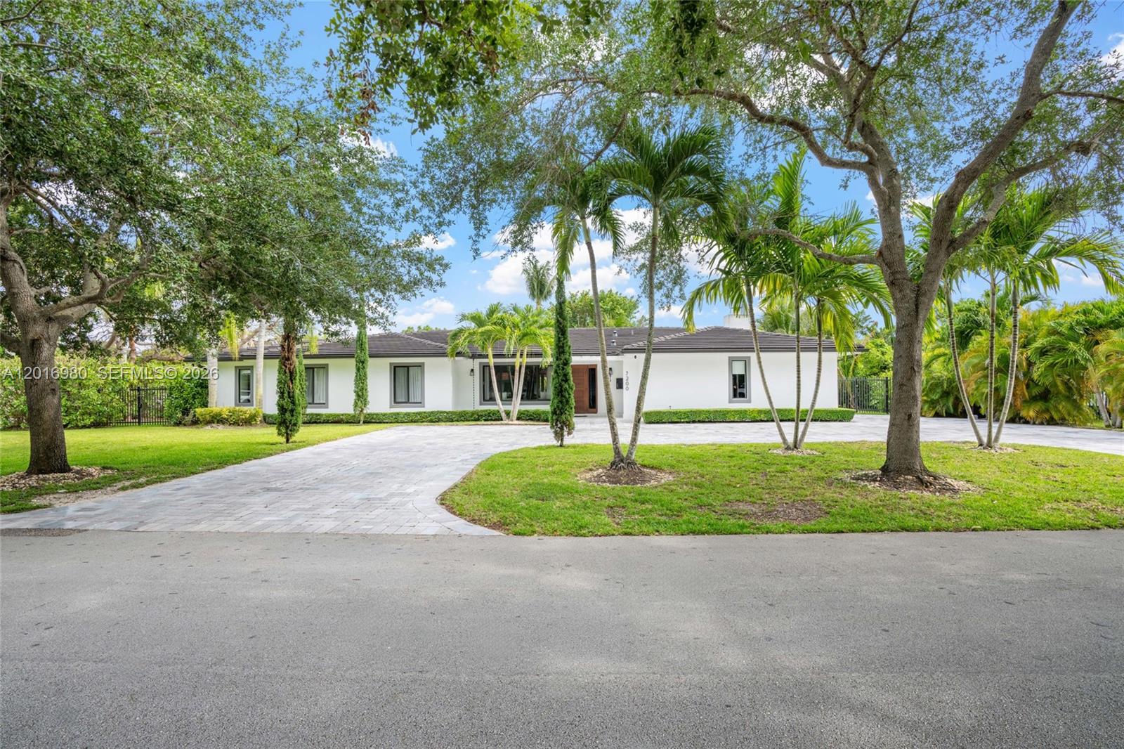 Stunning, totally renovated Pinecrest home blends timeless design with high quality modern upgrades, located on a quiet tree lined street in one of Pinecrest’s most desirable neighborhoods. Completely gutted and renovated in 2019, the interiors feature large format Greek marble, natural stone marble floors, marble countertops, showers, and vanities, along with oversized marble pool deck tiles surrounding the new heated pool. The chef’s kitchen is equipped with Sub-Zero and Wolf appliances, while the home also includes an Electrolux washer and dryer, two Trane A/C units, Ring camera system, Rain Bird wireless sprinkler system, and Jendy pool equipment. High-impact windows and doors, new roof, new plumbing and electrical. The village is celebrated for its access to some of Miami-Dade County’s top-rated public and private schools, expansive estate lots, exceptional parks, and family oriented atmosphere.
