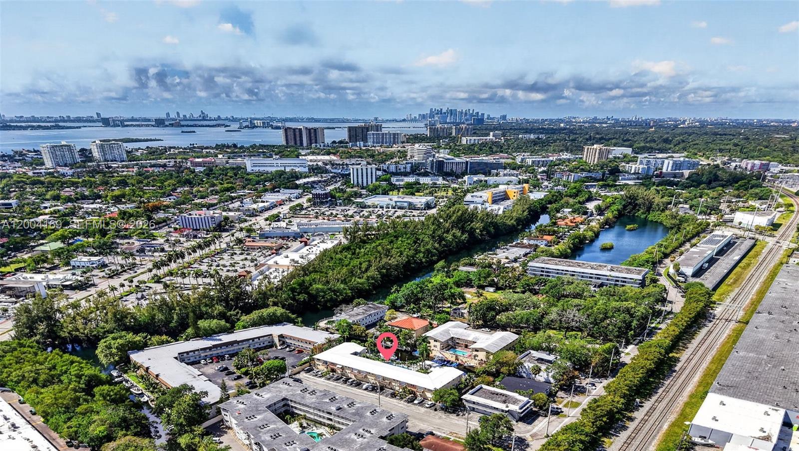 Recently renovated direct waterfront condo! This could be the lowest priced unit in South Florida with access to a deep canal which leads to ocean and unrestricted boating in shore or offshore! (2 fixed bridges) There is dockage available for your boat and you can start living the life you dreamed of at the lowest possible price point! This apartment features a living-dining area with modern and stainless steel appliances, ample storage space. Master bedroom with two large closets, an additional closet, full bathroom, plus backyard access -- The unit has its own double sliding glass door from the bedroom which leads out to a stunning little secluded backyard (only 4 total ground floor corner units). Enjoy amenities like FREE dock space, a heated canal-view pool, gated entrance, BBQ area, laundry, storage, parking, gardening, water, sewer and trash removal which is all included in the association fee of only $200 a month!  Ideal place for some relaxing privacy when having your breakfast, lunch, dinner and more. Just minutes from WholeFoods, Publix, Walgreens, Home Depot, Restaurants, Aventura Mall, Oleta River State Park & pristine beaches. Short distance from Florida International University and Barry University. Great opportunity for paddleboarding, kayaking, canoeing and boating from right outside your door. Can be sold furnished or unfurnished. This is a co-op property and new buyers are not allowed to rent out their unit. Hard to beat at this price point its a steal!