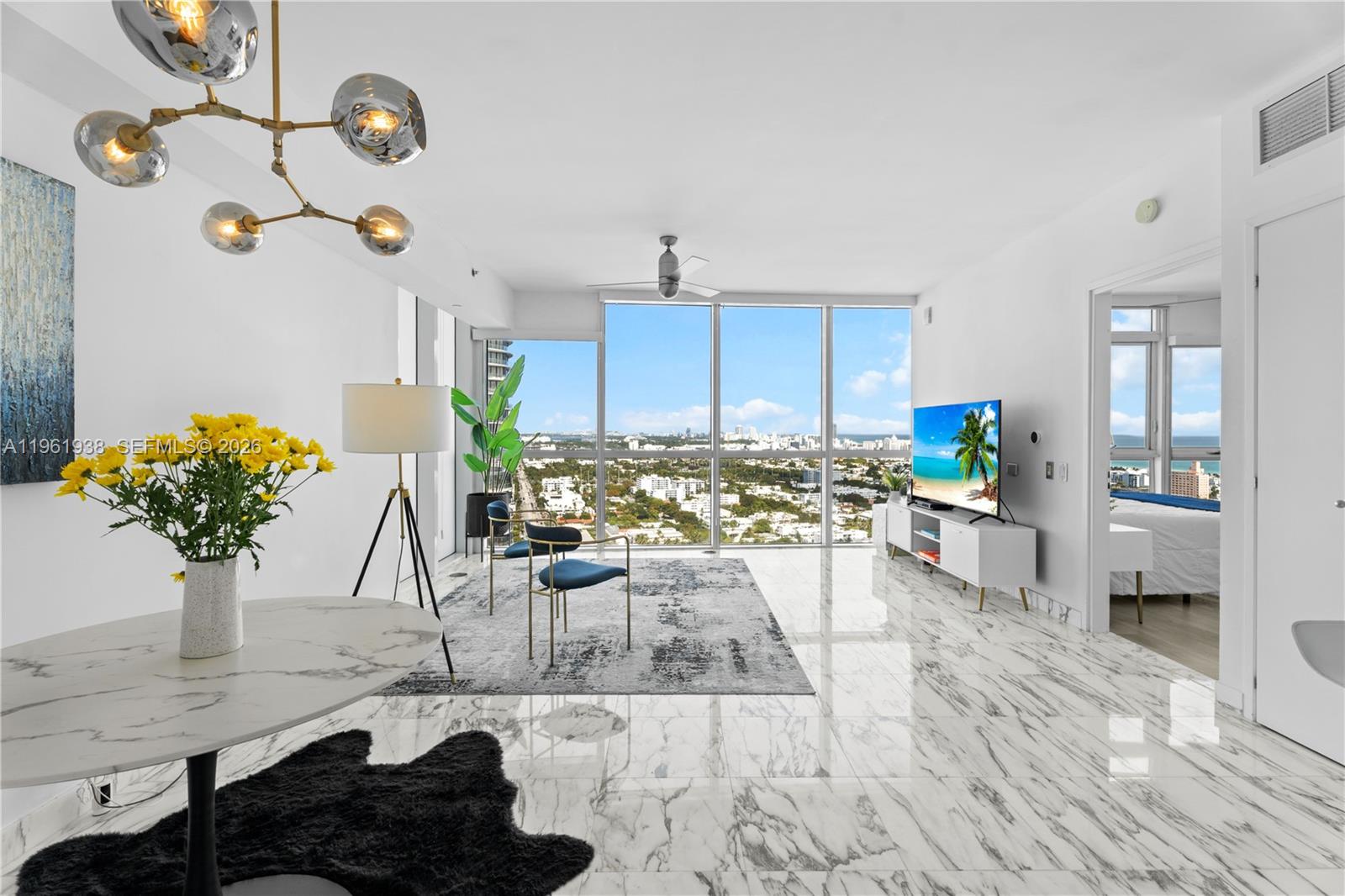 High-floor residence at ICON South Beach, 1-BR & 1.5-BA, featuring floor-to-ceiling windows and beautiful city and water views. Located in a full-service luxury building designed by Philippe Starck with resort-style amenities including a bayfront infinity pool, state-of-the-art fitness center, spa, sauna and steam rooms, restaurant, 24/7 concierge, valet parking and security. Prime South of Fifth location, steps from South Pointe Park, dining, and beaches.