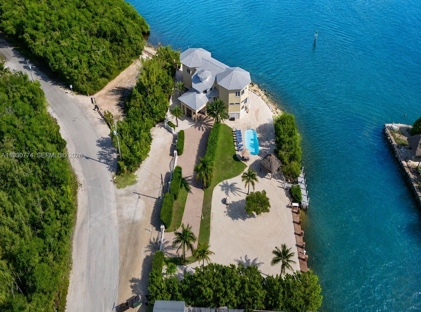 57 Garden Cove Drive is a rare Key Largo waterfront compound set on nearly 26,000 SF, offered together with an adjacent vacant residential lot for added flexibility and future potential.

The property features 6 bedrooms, 6 bathrooms, a private elevator, and bright, open living spaces that flow seamlessly into the tropical surroundings. Boaters will appreciate 100 feet of dockage with direct access to open water.

Approved for 7-day short-term rentals, the home is a successful vacation rental and wedding venue with strong income history. Combined with the additional parcel, it offers exceptional opportunities for expansion, added amenities, or the creation of a private resort-style estate.

A turnkey waterfront investment with income, lifestyle, and development potential in one of the Florida Keys’ most desirable locations.