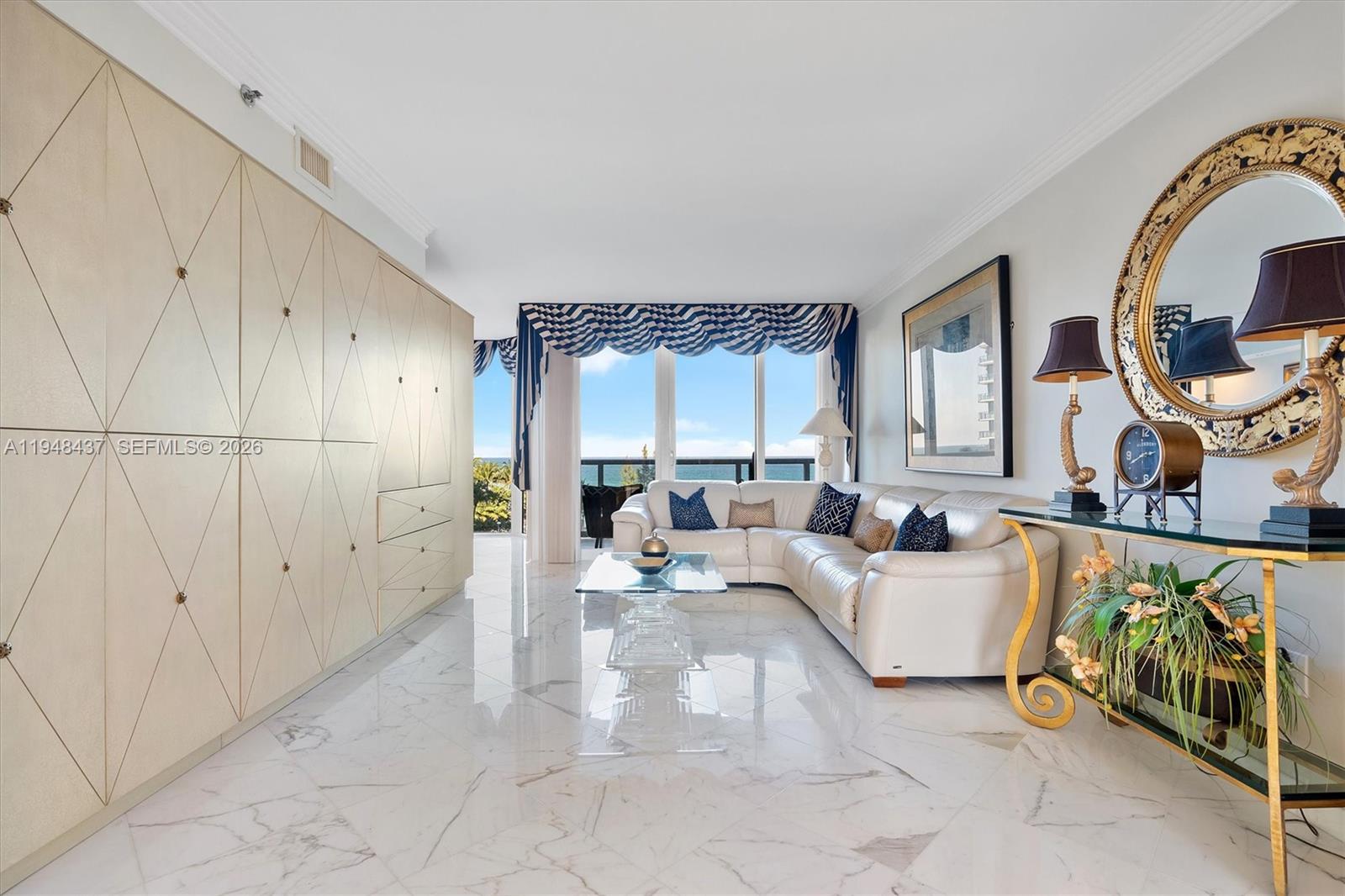 Residence 703 at Ocean One is a spacious flow-through luxury condominium offering breathtaking ocean and city views from sunrise to sunset. This elegant home features beautiful marble flooring throughout, floor-to-ceiling impact glass, a private foyer with direct elevator entry, expansive living and dining areas, and oversized terraces ideal for both relaxing and entertaining. The thoughtfully designed layout allows for abundant natural light and seamless indoor-outdoor living, making this residence perfect as a full-time home or refined coastal retreat. Ocean One is a prestigious full-service oceanfront building offering resort-style amenities including private beach access with chair and towel service, oceanfront pool, fitness center, spa, valet, concierge, and 24-hour security. Ideally located in Sunny Isles Beach, just minutes from Bal Harbour Shops, Aventura Mall, fine dining, parks, and top-rated schools, with easy access to both Miami and Fort Lauderdale. This is elevated oceanfront living at its finest. Storage #213 assigned to unit. Cable and internet included in HOA. Parking space is #B276, storage unit is #213