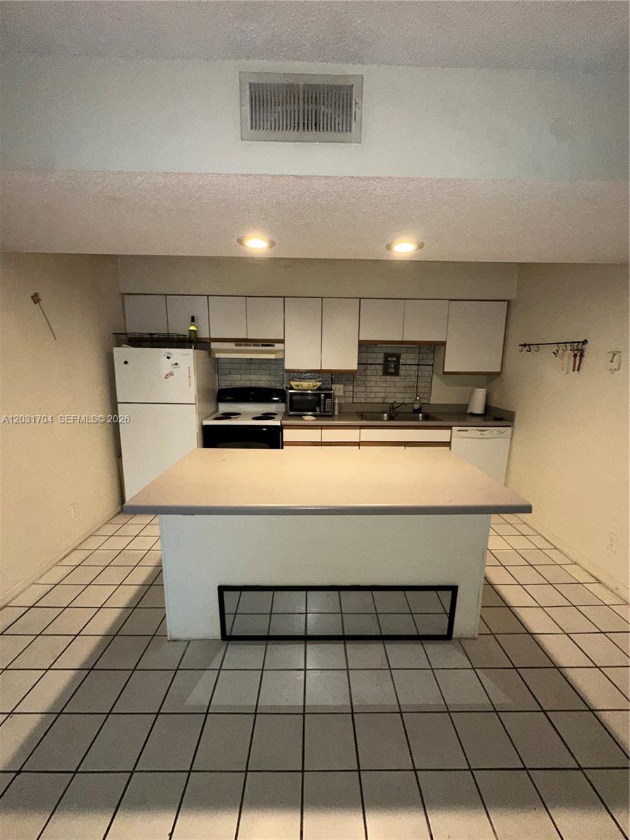 Investor-Friendly Top Floor Condo in Prime Pompano Beach Location!

Don't miss this fantastic opportunity to own a charming 1-bedroom, 1-bathroom top-floor condo offering beautiful open views from its private screened patio. This bright and inviting unit features the convenience of an in-unit washer and dryer, along with additional storage space, making it stand out from the competition.

The condo would benefit from a light cosmetic refresh, giving buyers the perfect opportunity to personalize the space while adding immediate value.

For investors, this property is especially attractive as the association allows rentals immediately after your closing, providing the potential for instant rental income. Plus, pet lovers will appreciate that up to two pets under 30 lbs each are welcome.

Residents enjoy access to excellent community amenities, including a large heated swimming pool, relaxing hot tub, and a beautifully updated clubhouse. Conveniently located near shopping, restaurants, entertainment, beaches, and major highways, this condo offers both lifestyle and investment appeal.

Whether you're looking for a rental property, a seasonal getaway, or an affordable South Florida home, this is an opportunity you won't want to miss.
Call or text listing agent to schedule your showing. Easy to show- Agent MUST ACCOMPANY HIS CLIENT TO THE SHOWING