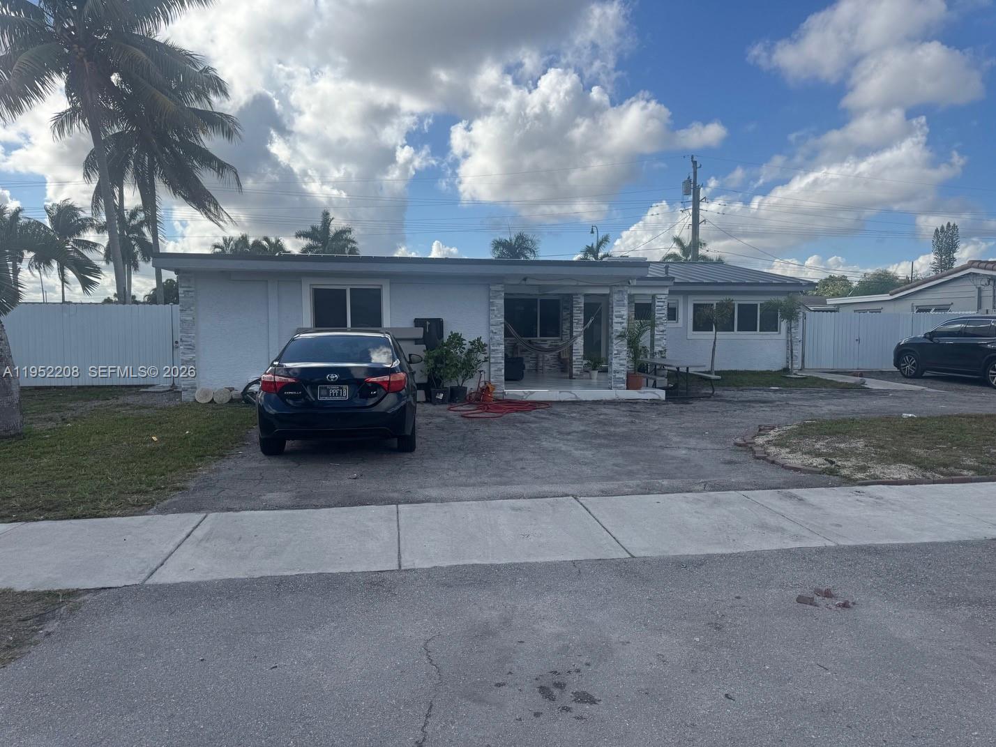 Welcome to 19700 NW 6th Place, a spacious single-family home located in the desirable Miami Gardens, FL 33169 community. This remarkable residence offers 6 generous bedrooms and 4 full bathrooms, ideal for large families or those seeking abundant living space. Situated on a large 10,139 sq ft corner lot, the property boasts outdoor space perfect for recreation, parking, and expansion opportunities.

Step inside to discover a well-designed, one-story floor plan featuring nearly 2,000 sq ft of living area with classic Florida architecture and tile flooring throughout. The home’s interior flows effortlessly, with ample living areas and a functional layout that accommodates both everyday living and entertaining.

The property includes a circular driveway with plenty of off-street parking, making it easy to host visitors or store multiple vehicles, recreational vehicles, or boats. Located minutes from Hard Rock Stadium and close to major roadways, shopping, dining, and entertainment, this home offers exceptional convenience and lifestyle appeal. Roof and window are 2023. A/C & Water Heater about 6 yrs old