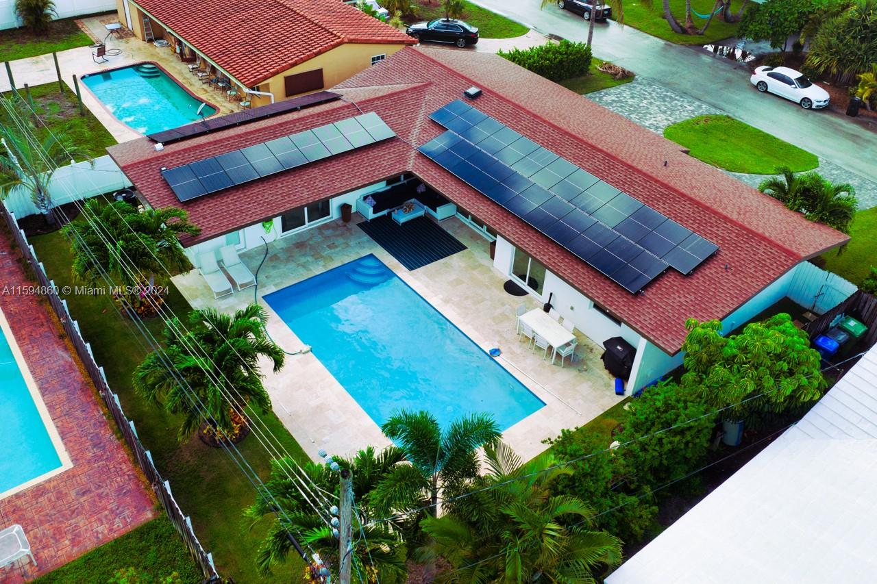 !!!Very Busy Airbnb over $95000 Rent for 2023 Fully furnished and turnkey 3/3 pool home in the sought-after Coral Ridge Isles! Enjoy the savings from new solar panels, making this home not just stunning but economically savvy. Brand-new saltwater pool, impact windows and doors, a freshly paved driveway, and a new AC system. Luxurious touches include an eco-smart tankless water heater, designer kitchen, and baths, as well as new landscaping. Split-bedroom floor plan with two master suites, one with a private entrance and a large walk-in closet. Open-concept layout, filled with natural light. Large 2.5-car garage, 10 minutes from Lauderdale by the Sea and the newly improved Pompano Beach. Nestled in the highly ranked Floranada school district, with proximity to Pine Crest and Westminster.