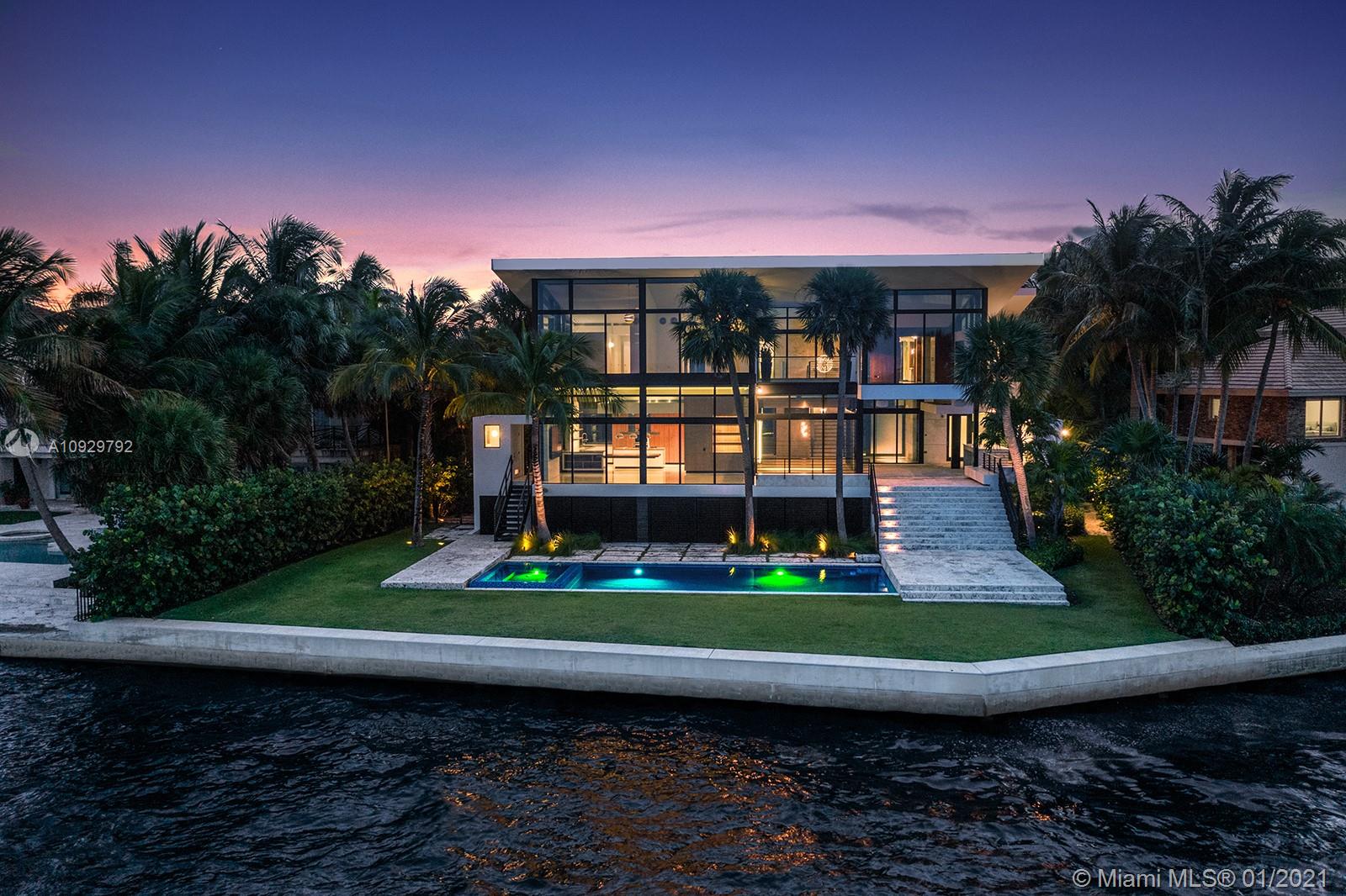 Designed for an indoor/outdoor experience! Masterfully constructed, this luxe Modern bay-front home offers spellbinding views of the Miami skyline & Biscayne Bay. Floor-to-ceiling doors & windows reveal uninterrupted panoramas. Terrazzo floors cultivate a seamless flow from all indoor social areas & out to the deck and summer kitchen. Solar powered heated pool & custom lighting design. The fully-outfitted kitchen showcases custom cabinetry with integrated appliances & quartzite counters. The master suite is an oasis with wood floors, impressive walk-in closet and endless views. Escape to the tranquil view on the top-level patio for morning coffee. Screening room w/black-out shades, projector/screen and sound system. Private entry guest suite. 75kW generator and EV charging station.