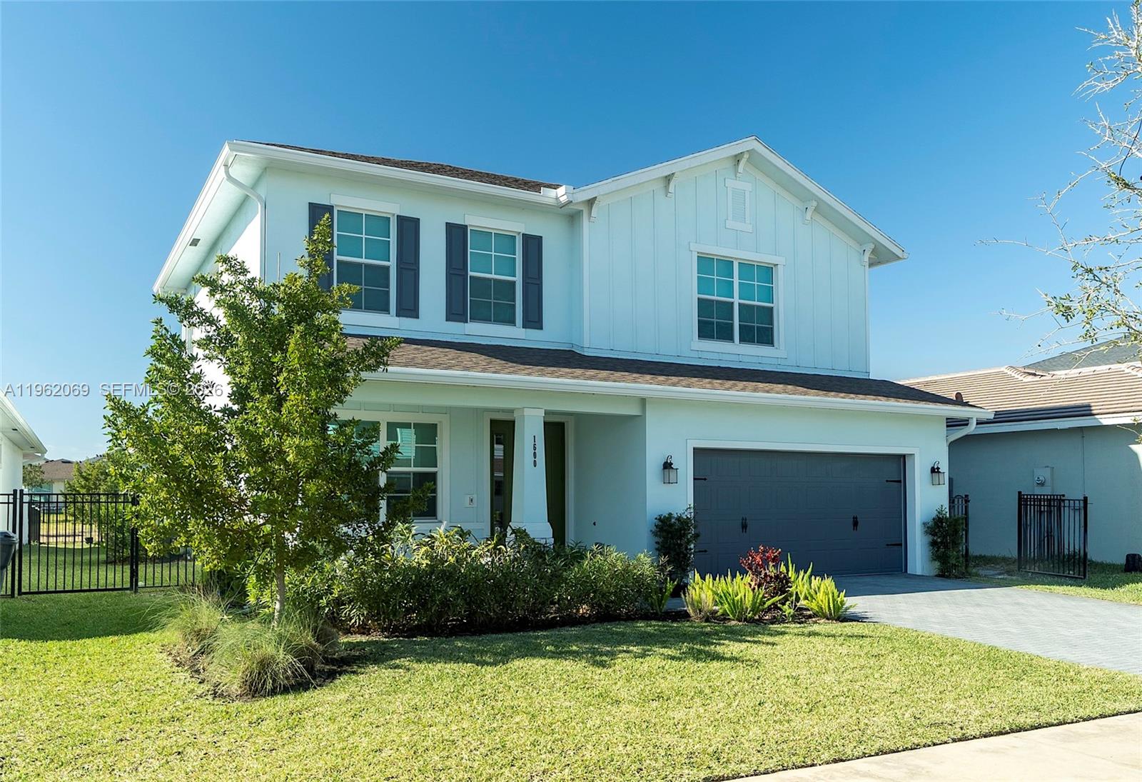 Recently built, handsomely appointed 2-story home available in Arden for sale. If you enjoy a relaxed, but sophisticated vibe, this house is for you!  Come see for yourself the Shiplap Walls, upgraded countertops with waterfall island, upgraded closets, crown-molding throughout, Ox-Floor garage with transferable warranty (for 10 years from original purchase), hardwood floors on stairs and throughout second floor and water treatment system...and don't forget the backyard- enjoy your patio and backyard designed for entertaining. Your oasis is complete with fruit trees for healthy snacking and shade. But the sophistication does not end with your house!  With Wellington International, home of the annual Winter Equestrian Festival, Equestrian Village and the National Polo Center roughly a 20-minute drive away, enjoy the lively equestrian festivities typically starting in late December and lasting through early May. 
Arden's unparallelled community amenities cannot be beat and with close proximity to HCA Florida Palms West Hospital, Aldi's, Publix and other conveniences, Palm Beach International Airport approximately 20 miles away, as well as well-regarded Wellington Landings Middle School ("Overall Niche Grade A-") and Wellington Community Highschool ("Overall Niche Grade A"), this total package will not last!  Niche grades for schools as of March 6, 2026.