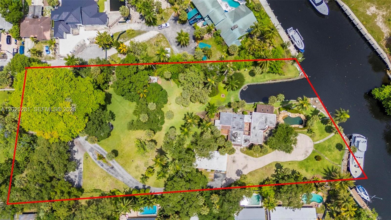 A trophy waterfront opportunity on the New River to be reimagined. This incredibly rare 2.43-acre point lot offers nearly 400 ft of combined waterfrontage, including approximately 200 ft directly on the river plus another approximately 200 ft along a protected 32-ft-wide wet slip — creating a uniquely private, marina-like setting with exceptional boating potential.

Zoned RS-8 with potential for up to 8 residential lots per acre, the property presents an extraordinary opportunity for a luxury estate, private compound, boutique waterfront enclave, or future residential development. 

Nestled within lush tropical landscaping sits a sprawling Spanish-style ranch estate rich in craftsmanship, timeless woodwork, intimate patios, and tranquil porches that evoke peace and serenity in the heart of the city. Truly one of Fort Lauderdale’s most unique and irreplaceable properties.