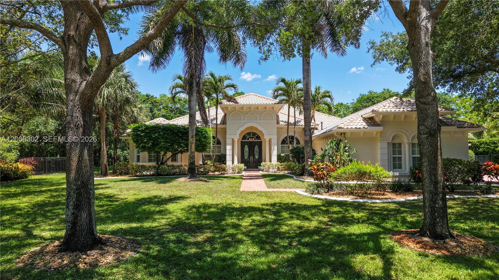 Rare opportunity in Grove Creek Ranches, one of Davie's most prestigious gated enclaves. Set on a Builder's Acre (~36,000 SF) with a "no neighbor" rear orientation for ultimate privacy and a secluded backyard retreat.
The home offers 3,486 SF of refined living space with 5 bedrooms and 4 bathrooms. A standout upgrade: Hurricane Impact Windows throughout — rare in this community, where most homes have shutters.
Boutique gated living with equestrian charm, top-rated schools, and easy access to all of South Florida. A must-see for the discerning buyer.