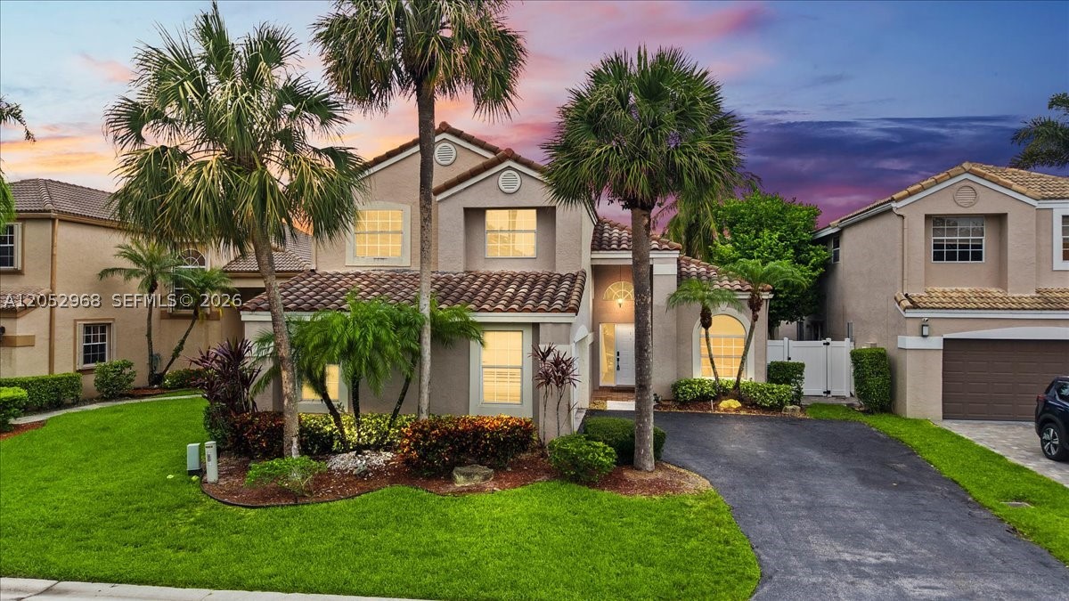 Welcome to this beautifully remodeled  home in the heart of Desirable Parkland, where modern elegance meets serene pool & waterfront living. Designed for both comfort and entertaining, this move-in-ready residence features spacious living areas, with pool view, vaulted ceilings, an updated kitchen with an eat-in kitchen island opened to the family room. Large Master suite is downstairs, Master bath features a soaking tub and separate shower, 2 walk-in closets with direct access to the pool. Upstairs are 3 spacious bedrooms and a loft. New AC in 2024.  Step outside to your private backyard oasis, complete with a sparkling pool with fountains overlooking tranquil water views—the perfect setting for relaxing evenings, weekend gatherings, or enjoying South Florida's year-round sunshine. With its thoughtful upgrades, generous floor plan, and picturesque waterfront location, this exceptional home offers the ideal blend of luxury, functionality, and the coveted Parkland lifestyle.