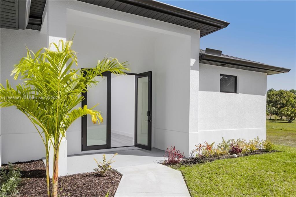 Welcome to your dream home in Lehigh Acres! This stunning single-family home boasts 3 bedrooms, 2 bathrooms, and a spacious 2-car garage. The modern finishes include granite counters, stainless steel appliances, and high impact windows. With high ceilings, this home offers a luxurious and peaceful retreat. The best part? No HOA fees or CDD taxes to worry about. Don't miss out on the opportunity to own this beautiful property in a desirable location. Make this house your home today!