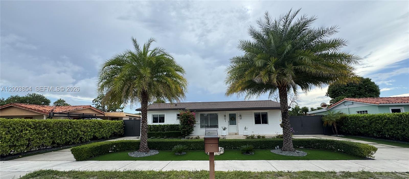 This beautifully updated 4-bedroom, 2-bath home combines modern upgrades with a charming coastal exterior. Designed for both comfort and functionality, the property features impact windows and doors, a new roof (2023), and a fully permitted driveway.

Step inside to find updated bathrooms and a bright kitchen enhanced by skylights that fill the space with natural light. The home also includes a spacious laundry room complete with a sink, wine cooler, and additional storage closet for added convenience.

Outdoor living is a standout feature, with an insulated porch area ready for your dream outdoor kitchen. The backyard is finished with low-maintenance artificial turf, two storage sheds, and is fully fenced with aluminum fencing and lush privacy hedges—perfect for entertaining or relaxing in total privacy.

Additional highlights include legal in-law quarters, gutters, a gas tankless water heater, gas dryer, and a soft water system with a whole-house filtration system.

This move-in-ready home offers the perfect blend of style, efficiency, and versatility.

***Please use ShowingTime for showing instructions***