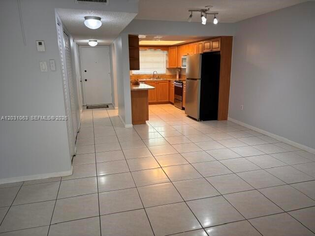Discover this townhouse located in a vibrant Miami neighborhood. Featuring two bedrooms and two and a half bathrooms, this home has a comfortable living space with an open-concept layout. The kitchen is equipped with very nice appliances. Enjoy the convenience of in-unit laundry and a private patio. Community amenities include a pool, tennis court and security gate. Close to FIU, schools, shopping, dining, and entertainment options