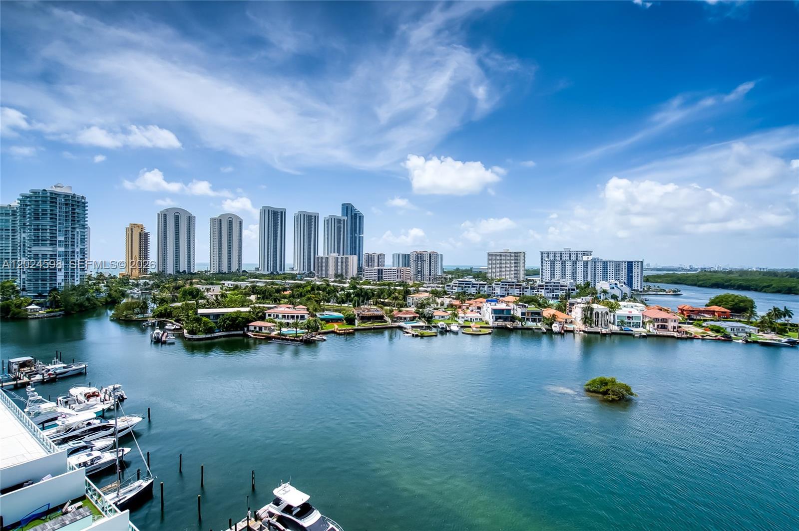 Stunning two-story Sky Loft residence at 400 Sunny Isles offering 1,710 SF of contemporary waterfront living. This unique 2-bedroom, 3-bathroom floor plan features soaring spaces, floor-to-ceiling impact glass, an open gourmet kitchen with premium appliances, and a spacious living area that seamlessly flows to an oversized terrace overlooking the Intracoastal Waterway.

Enjoy breathtaking panoramic views of Biscayne Bay, Oleta River State Park, Sunny Isles skyline, luxury waterfront estates, and distant ocean vistas from your private balcony. The flexible enclosed room with glass sliding doors is ideal as a family room, formal dining room, home office, guest suite, or potential 3rd bedroom.

The upper-level primary suite offers exceptional privacy, a large walk-in closet, and a spacious spa-inspired bathroom. Additional features include abundant natural light, modern finishes, and an in-unit washer and dryer.

400 Sunny Isles is a luxury waterfront community featuring marina access, resort-style pool, tennis courts, fitness center, spa, concierge, valet, and 24-hour security. Ideally located just minutes from the beach, Aventura Mall, Bal Harbour Shops, fine dining, parks, and major highways.

Easy to show. Call today.