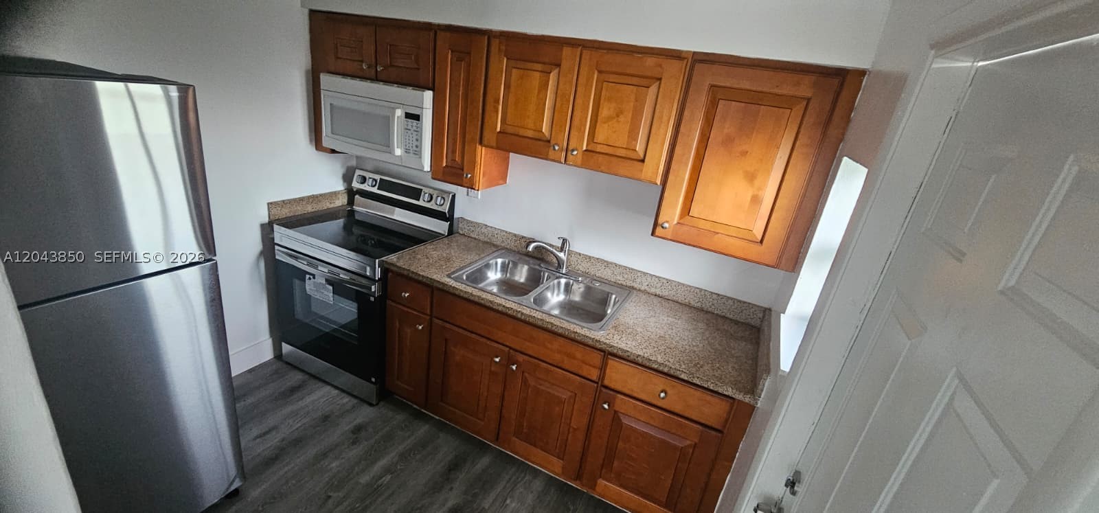 Beautifully remodeled 2-bedroom, 1-bath apartment in a prime location! Features new flooring, fresh paint, updated finishes, and stainless steel appliances. Enjoy off-street parking, water included in the rent, and a quiet residential street just minutes from major highways, shopping, dining, and more. Move-in ready—don't miss this opportunity to make it your new home! Quick approval, housing assistance welcome!