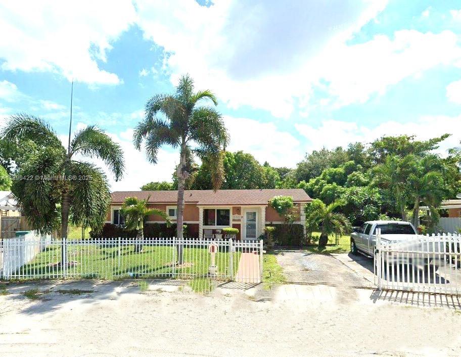 LAAARGE LOT 12,150 Sq ft. and FULLY FENCED. That's just the beginning because the inside of this 3 bedroom 1 bath is gonna make you want it.  You'll definitely like what you see because the front curb appeal alone peaks your curiosity. Features include: EVERYTHING UPDATED;  The roof was completely redone (2021), High Impact Windows, High Impact Doors, High Impact French Doors (2019),  Huge backyard, lots of fruit trees, plenty of room for expansion and also a pool.  All that you must bring is your toothbrush.  Seller is ready to sell. NO HOA.