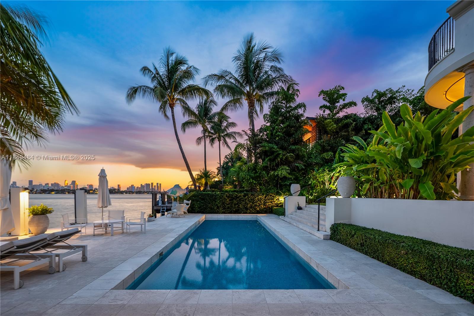 Located on prestigious Sunset Island III, this exquisite 6-bed, 5.5-bath Spanish-style home blends timeless elegance with modern comfort. Soaring 12' ceilings, French limestone floors, and a coral stone courtyard set the tone for refined indoor-outdoor living. The chef’s kitchen boasts a Calacatta marble island, Wolf appliances, gas stove, and dining area flowing into a family room with sweeping Biscayne Bay and Miami skyline views. Upstairs features 10' ceilings, Brazilian cherry floors, and a primary suite with dual walk-ins and a private bayfront terrace. A detached guest house offers privacy and flexibility. Your backyard escape awaits with a heated saltwater pool, outdoor shower, and private dock 13,125 SF lot with direct bay access.
