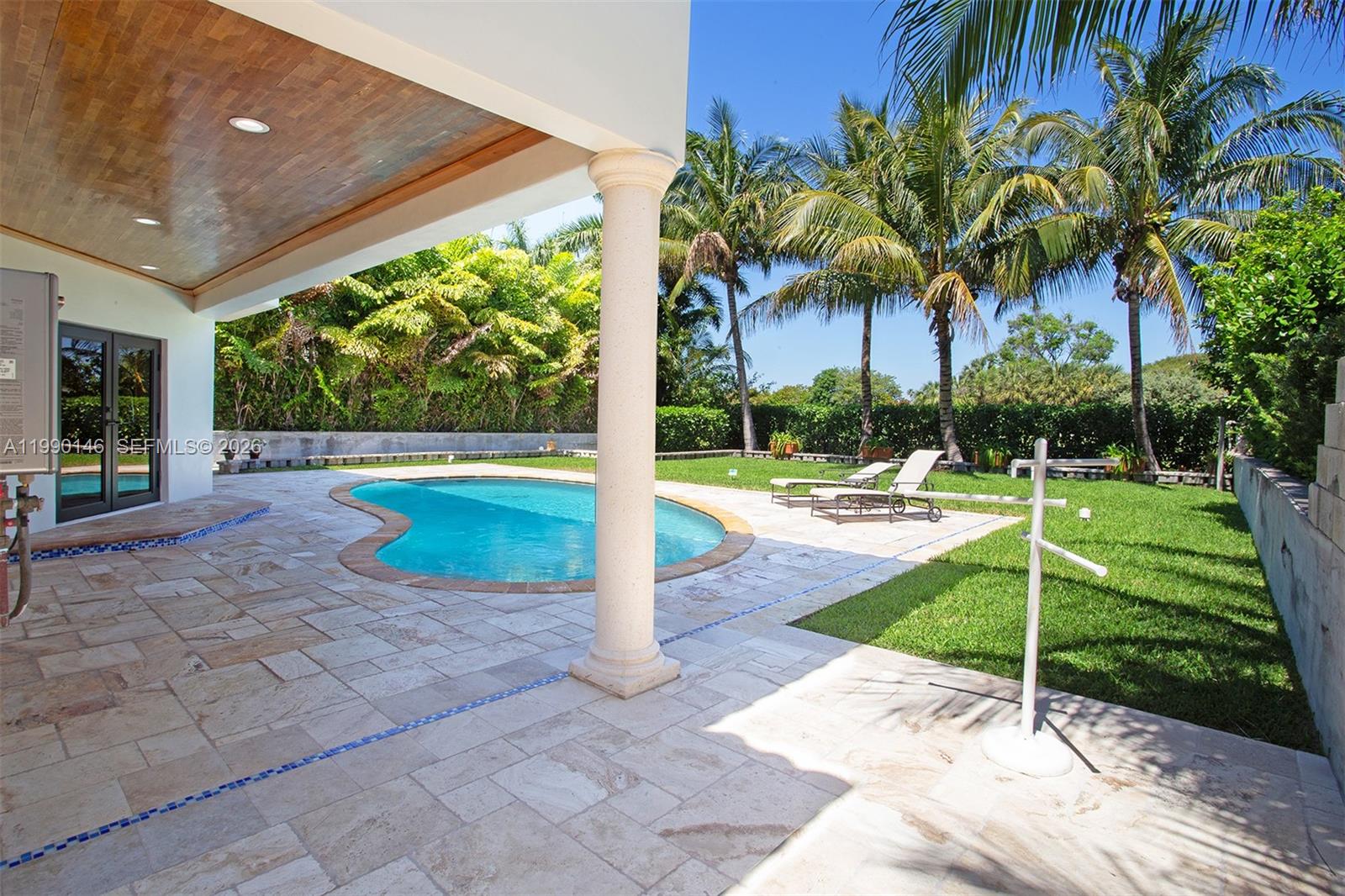 Located on a private gated island in Miami Beach, this residence sits on the 12th hole of the Miami Beach Golf Club and features one of the best lots on the island with beautiful golf course views. The home offers all impact windows and doors, spacious light-filled living areas, and a chef’s kitchen designed for cooking and entertaining. Newly renovated bathrooms and showers add a modern touch. The oversized backyard overlooks the fairways and features a pool and generous outdoor space. Residents enjoy close proximity to the golf clubhouse, tennis courts, and Fairway Park, all just minutes from Miami Beach’s beaches, dining, and shopping.