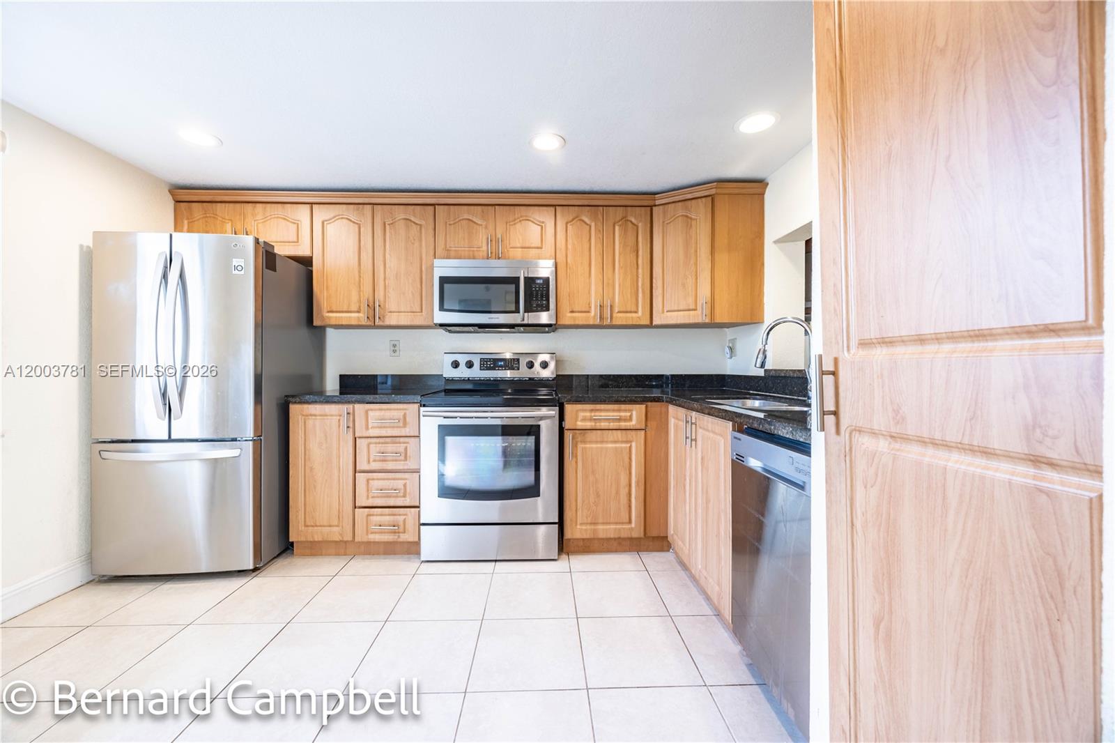 Experience resort-style living in a beautifully maintained 18-hole gated golf community with 24-hour security. This turnkey 2-bedroom, 2-bath condo offers 1,260 square feet of thoughtfully designed living space, featuring an open family and dining area perfect for relaxing or entertaining. Step directly from your bedroom onto your private patio and enjoy the peaceful surroundings. The spacious primary suite includes a comfortable sitting area and generous walk-in closets. The kitchen is appointed with granite countertops and stainless steel appliances, blending style and functionality. Tile flooring runs. throughout the main living areas, with laminate wood flooring in the bedrooms for added warmth and comfort. A washer and dryer are conveniently located inside the unit. Residents enjoy an impressive array of amenities, including a fitness center, swimming pools, billiards room, library, and community center. Water and cable are included, adding exceptional value and convenience. Association requirements include a 710+ credit score, minimum $45,000 annual income, 20% down payment, and 55+ residency. Don’t miss this opportunity—schedule your showing today!