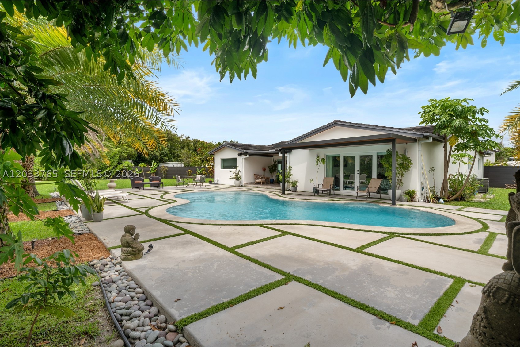 Sunshine, space, and style come together in this beautifully renovated 4-bedroom, 3-bath contemporary ranch home. Nestled on an oversized lot, this turnkey home offers an open-concept layout, designer finishes, impact windows, and a gorgeous contemporary kitchen. Spend your weekends by the pool, entertain under the stars, or simply unwind in the tranquility of your lush backyard oasis. Separate 2 garage, premium upgrades, and a truly move-in-ready. Pets welcome with a beautiful outdoor kennel.