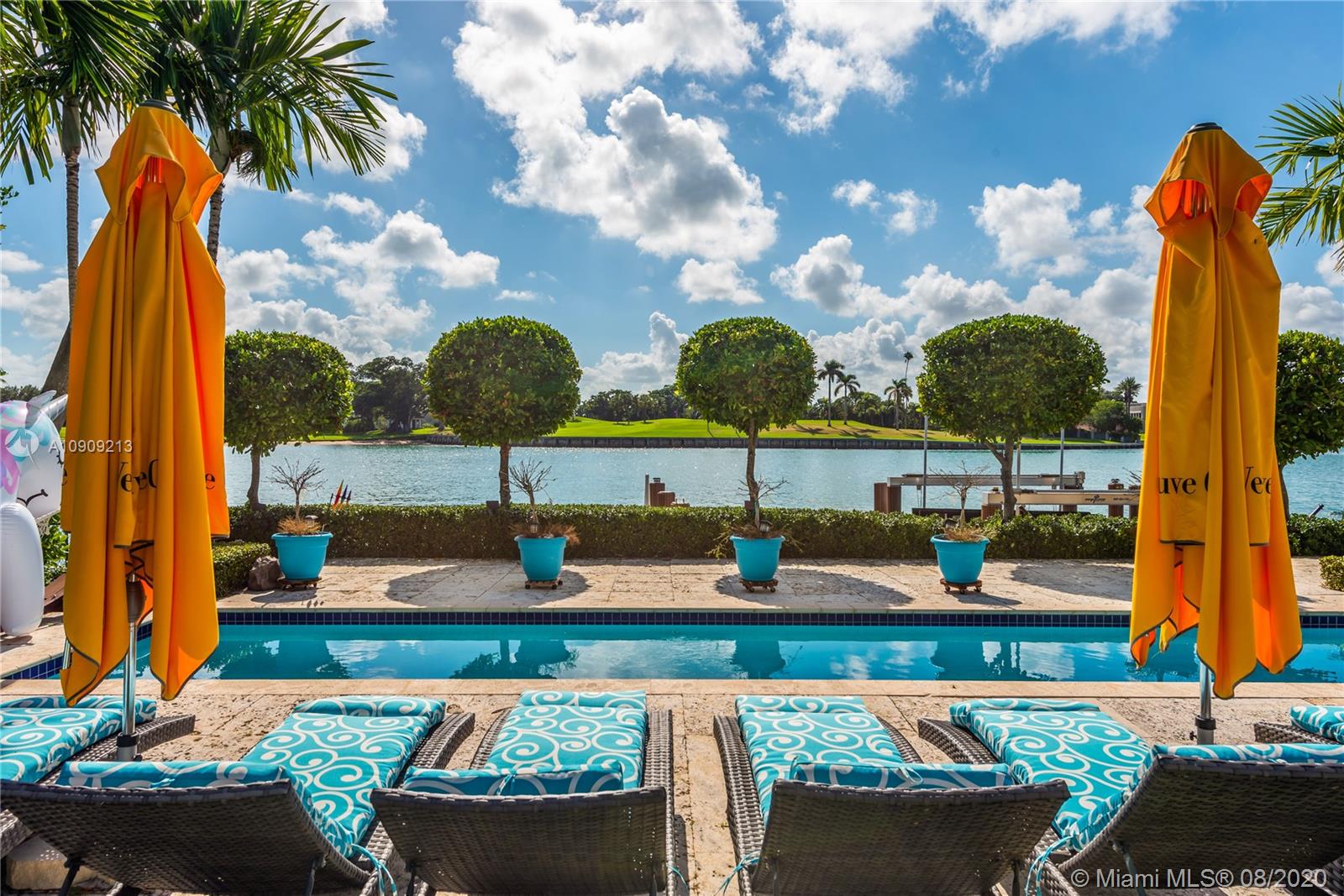 A truly special residence to call home! Experience peace, serenity & amazing sunsets w/unobstructed Bay & Indian Creek Golf Course views in coveted Bay Harbor Islands. Stunning Mediterranean Estate built in 2004, 7BD/5Full/2Half BA, 7,160SF/A/C incl guest cottage/per owner. Situated on a lush 16,406SF lot w/105’ waterfront, large dock w/24,000lb boat lift, deep water w/direct ocean access, 75' heated lap pool, covered lounge areas & dining w/summer kitchen. Magnificent foyer entrance w/double height ceiling, grand living w/fireplace, elegant formal dining, media room w/customized built-ins, gourmet kitchen,800+ bottle temp-controlled wine cellar, impressive 2nd story master suite w/french doors opening to oversized private terrace facing South showcasing panoramic Bay & Golf Course views.