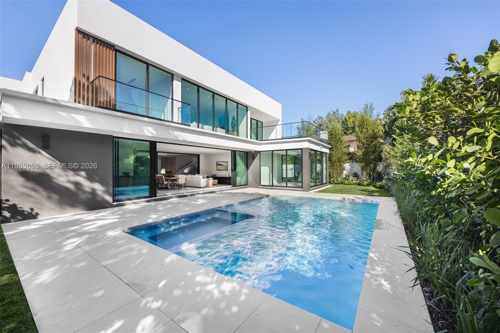 Casa 30 is a newly built modern masterpiece in North Coconut Grove’s exclusive, patrol-secured Bay Heights. Elevated above the flood zone, this private sanctuary offers refined living with prime access to parks, the Grove, and downtown. Developed by Urbane Capital and Billskog Construction, it features Italian Pedini millwork, Miele appliances, soaring ceilings, custom finishes, a private elevator, a gym, a loft with midnight kitchen, and a luxurious primary suite with a spa-style bath, dressing room, and private terrace overlooking the lush, walled garden. Outdoor living includes a summer kitchen and heated saline pool with spa — a true expression of contemporary luxury.
