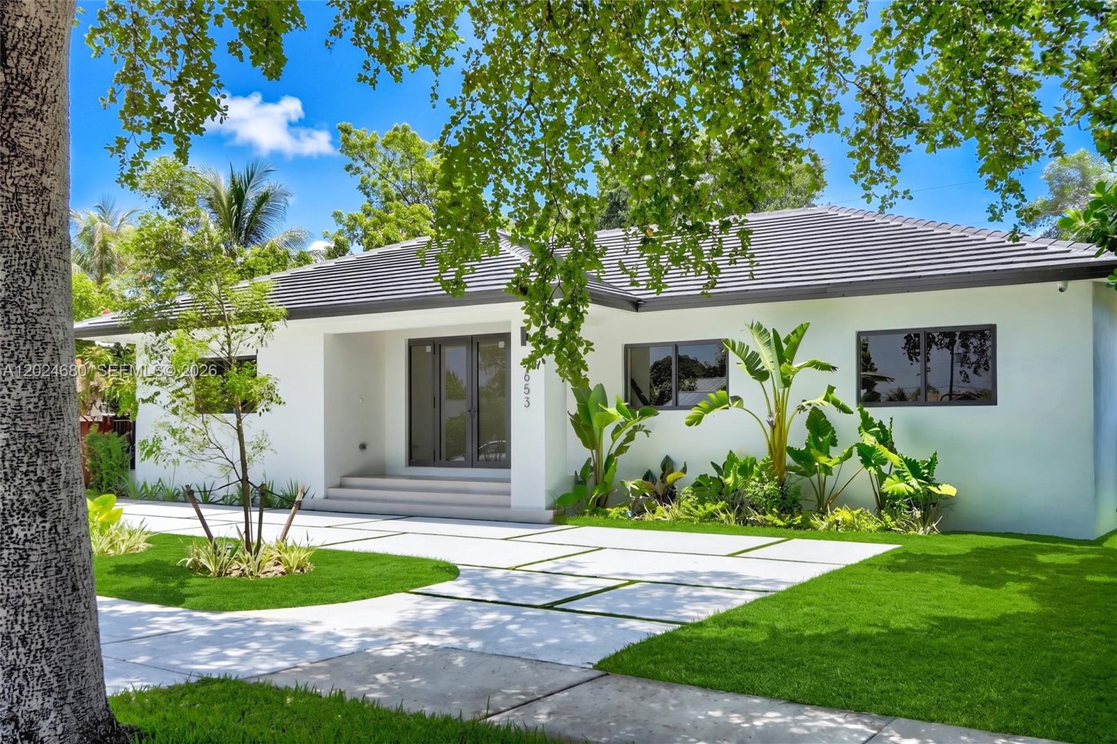 New construction residence on a 9,000 SF canal-front lot, offering 4 bedrooms and 3.5 bathrooms, including a private guest suite with bedroom, full bath, kitchenette, laundry, private entrance, and its own living area. Designed with high-end finishes throughout, Italian doors, open living spaces, wood-ceiling covered terraces, integrated indoor/outdoor sound system, security cameras, and a resort-style pool with spa features and shallow sun shelf. The home blends luxury, privacy, and functionality, with beautiful canal views and mature trees that create a rare sense of space and serenity. An expansive backyard offers exceptional outdoor living and entertaining potential. The residence offers 3,148 SF under roof. Total area includes thoughtfully designed indoor and covered outdoor living spaces finished with the same level of quality and detail. A unique new construction opportunity in a highly desirable 33155 location.