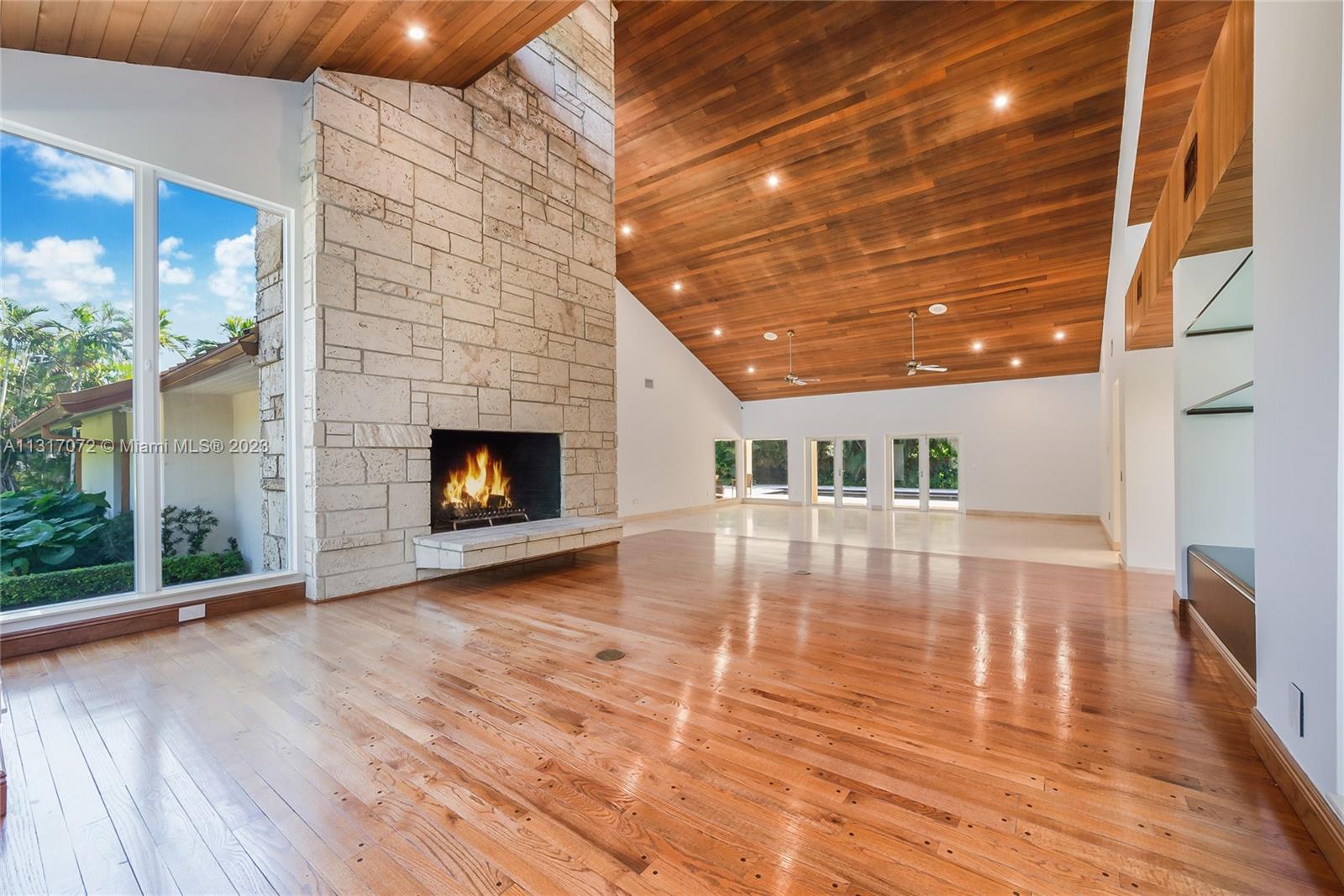 HUGE PRICE REDUCTION !Pinecrest Grove- Gated Community of only 9 homes, all on 1 + acre lots- Award Winning Hollub Design - Huge 43,560 sf wide lot- many fruit trees,6 bedrooms 4 1/2 baths, 6734 sf under AC, Total 8073 sf . Impact windows + doors, metal roof, back up generator, 2 garages ( 2 car+ 3 car ) Total 5 car garage. 2 master suites,fitness room or home theatre, Indoor Laundry, Huge Formal Dining room,Impressive High Wood beam Living room with tall coral rock stone fireplace. Covered outdoor terraces with outdoor kitchen, lots of covered outdoor covered seating around the pool, Lush landscaping, circular driveway, very private back yard. This is a unique home in a very desireable pineccrest gated communit. House is Immaculate and ready to move in.