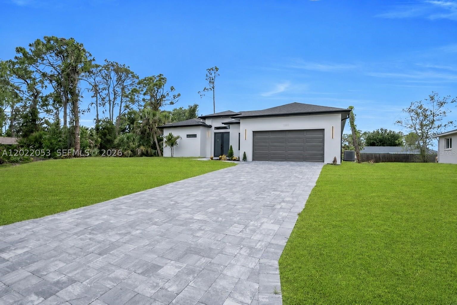 Pre-construction – to be built. Modern single-family home featuring 3 bedrooms and 2 bathrooms with an open-concept layout. The kitchen offers a central island overlooking a spacious great room, perfect for entertaining. The primary suite includes a walk-in closet and private bathroom for added comfort and privacy. Additional highlights include a covered lanai and a 2-car garage. Property is located outside of a flood zone, providing added peace of mind. Photos are of a similar model.
