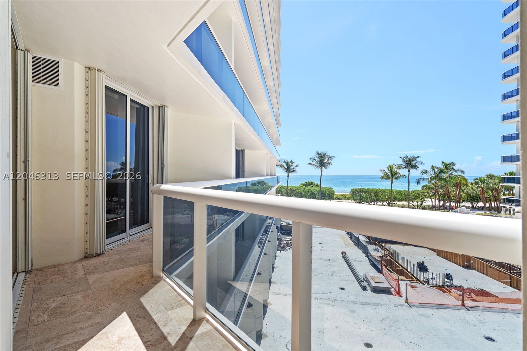 Enjoy beautiful ocean & pool views from the sunny south side of Solimar's coveted North Tower.  A semi-private elevator foyer welcomes you into a 1,740 sq.ft residence with 2 bedrooms & 2.5 baths. The split- bedroom layout showcases marble flooring throughout the main living areas, carpeted bedrooms  & an expansive open-concept living & dining space. Perfect for entertaining, the kitchen includes a convenient pass-through to keep you connected with guests. The primary suite serves as a private retreat, offering exceptionally generous closet space & a spa-like bathroom newly upgraded with sleek glass shower enclosures. As a full-service luxury building, Solimar delivers a resort lifestyle featuring a state-of-the fitness center, dedicated men's & women's spas, an attended pool and full service beach service. The residence inc. 1 assigned self-parking space w/complimentary valet available for a 2nd vehicle. This premier beachfront address is ideally situated between the world-renowned Bal Harbour Shops & the charming boutiques & dining along Surfside's Harding Avenue.