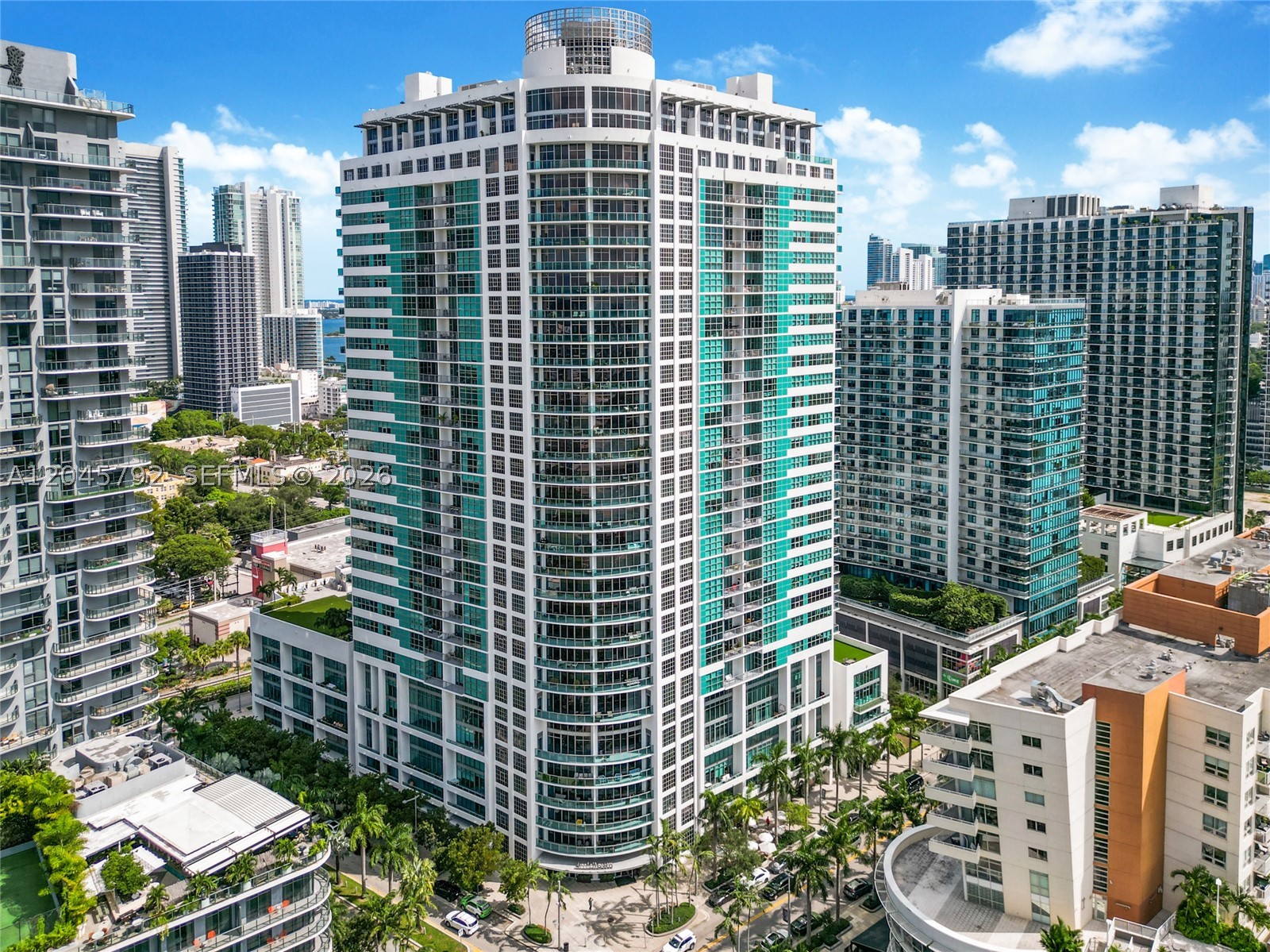 Stunning fully furnished 2-bed, 2-bath gem nestled in the heart of Midtown! This residence is flooded with natural light, boasts captivating city views, and showcases unique 14-foot floor-to-ceiling glass windows that are exclusive to this level. 4Midtown presents an array of amenities including a large pool deck with a Jacuzzi, a well-equipped gym with a yoga room, a sauna, steam room, barbecue area, a clubhouse, and round-the-clock concierge service. Convenience is paramount with this location, as you'll be within walking distance of the vibrant Miami Design District, shops, cafes, restaurants, and much more. Maintenance includes water, basic cable, and basic internet services. Discover a lifestyle of opulence and sophistication in the heart of Midtown!