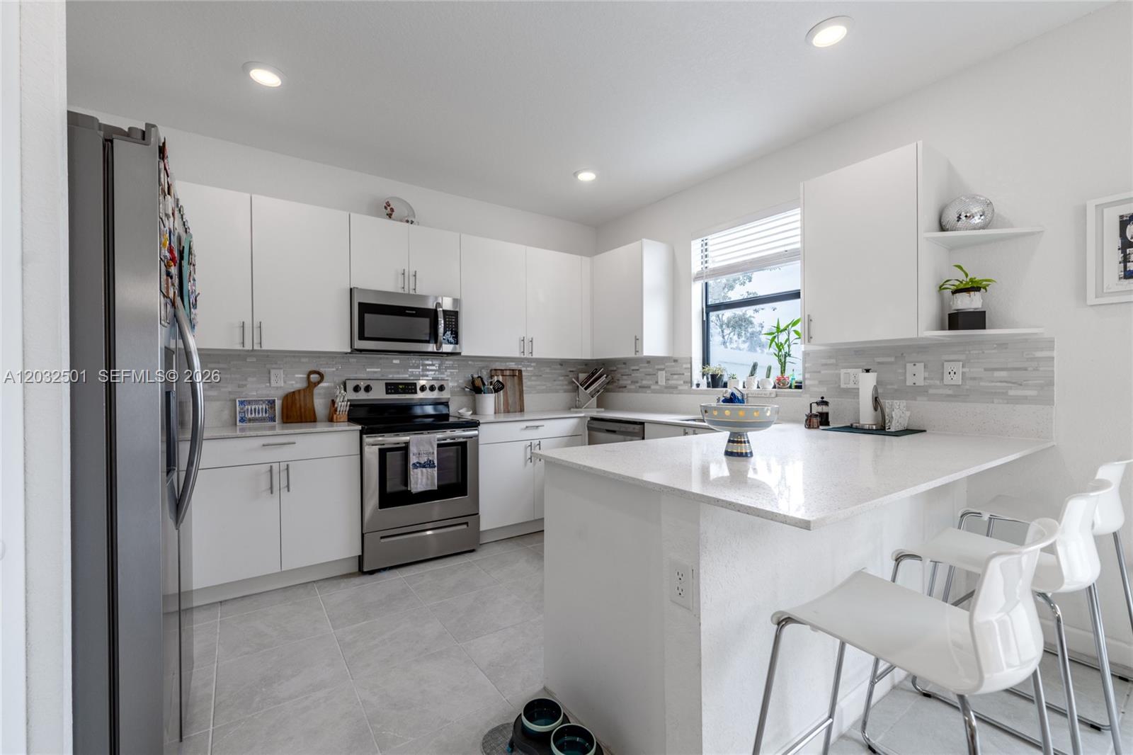 Move-In Ready Upgraded Townhouse with Lake View in Miami Gardens! Beautifully maintained 2-story townhouse
with serene lake views and only one previous owner. Features include a modern kitchen backsplash, vinyl flooring
on the second floor, custom closet systems, and backyard pavers—perfect for outdoor living. Located in a gated
community offering a pool, fitness center, and clubhouse. Convenient access to major highways, shopping, dining,
and entertainment. Turnkey and ready for immediate occupancy!