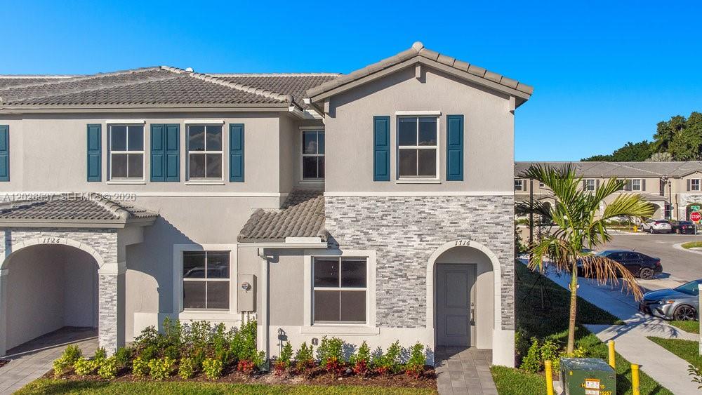 CORNER VILLA in the beautiful gated community "Riviera". Two story,3 beds/2.5 baths. Ceramic Tile on first floor and carpet on second floor, stainless steel appliances, quartz countertop and back patio. Smart home design in the most desirable Homestead area. Two parking spaces just in front of the property plus guest parking.  Clubhouse includes swimming pool, fitness center, game room and much more. Kids playground and bbq areas. Prime location just minutes from shopping, dining, schools, hospitals and more. Investment opportunity. Lease in effect with excellent tenant . Rented for $2,530. Lease ends on May 01, 2027