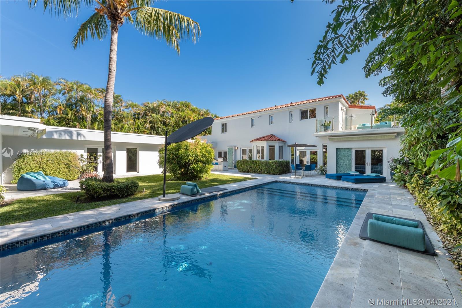 Superbly remodeled and exquisitely furnished with high-end European furniture by Paola Lenti and Ligne Roset, this art deco gem on tranquil Flamingo Drive in South Beach is offered fully furnished and move-in ready! Updated in 2017 with impact glass windows, Control4 system, new baths, new HVAC, and modern chef’s kitchen, this luxe home offers great living space, breakfast room, formal dining, media room, office, and 2 beds down. Beautiful staircase with intricate tile design wall will take you to the 2 bedrooms up, including the master suite with an opulent bath, 2 walk-in closets, and a private terrace. The lushly secluded backyard is equipped with a saltwater pool, pizza oven, summer kitchen, and patios for lounging. Perfectly located near the beach. Rare find!