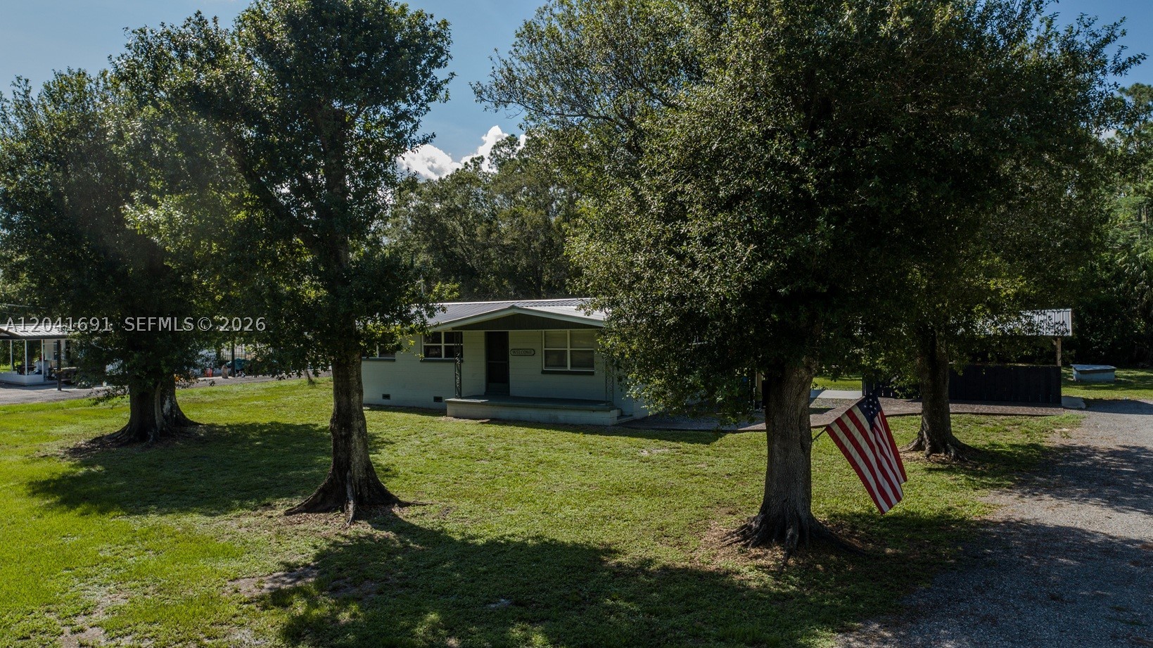 Well-maintained 3BR/2BA home on an oversized .63+/- acre homesite! This move-in-ready property has been lovingly cared for and offers numerous updates, including newer flooring, fresh interior paint, updated interior doors, and modern fixtures. The home also features a durable metal roof and a newer submersible water pump for added peace of mind. Step outside to enjoy the huge back porch and cabana area - perfect for relaxing or entertaining family and friends.