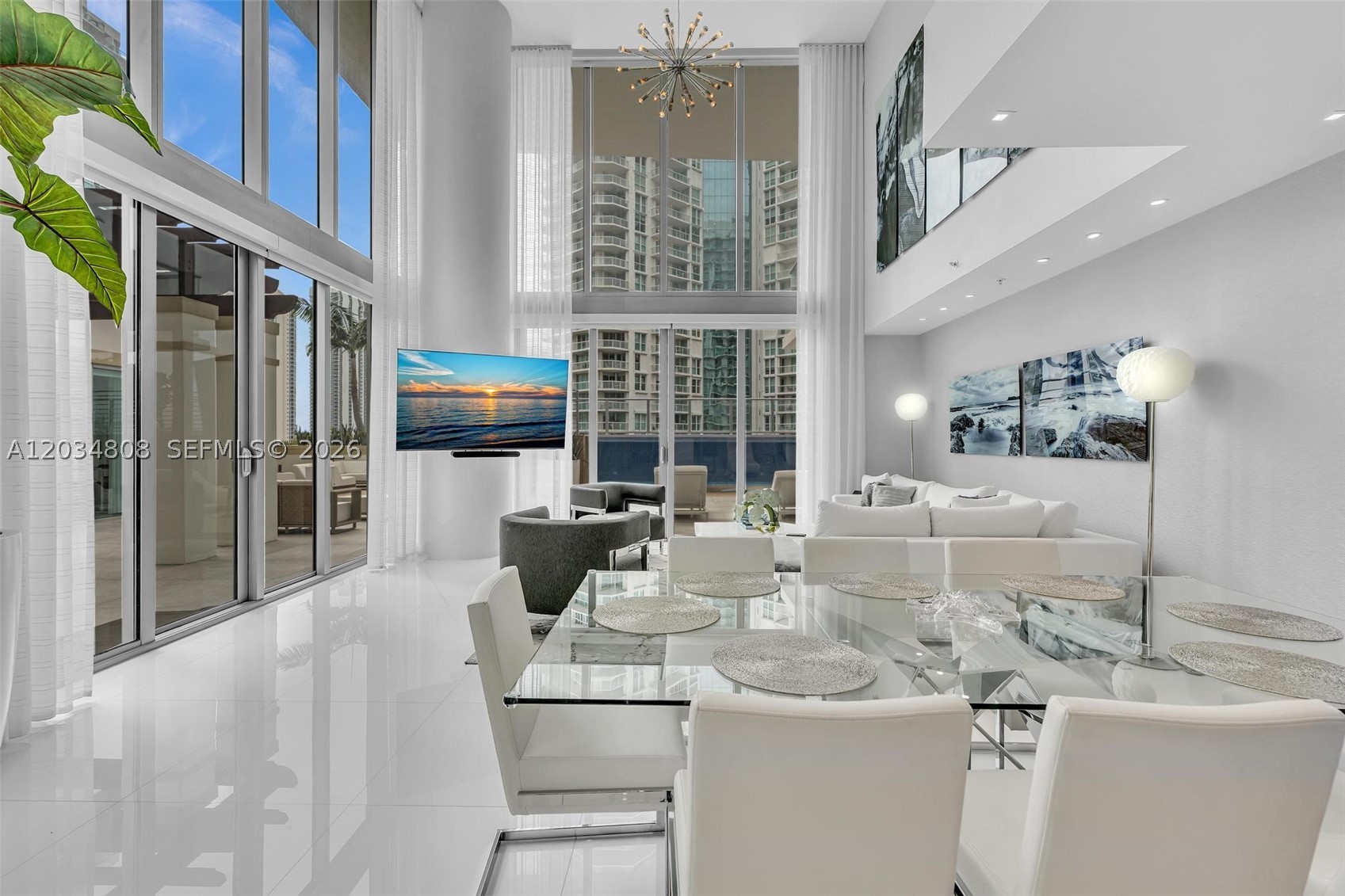 RARE OPPORTUNITY! Experience the pinnacle of luxury living in this extraordinary TWO-STORY WATERFRONT VILLA at Parque Towers. Offering 4,650 SF of interior living space and an additional 3,909 SF of private outdoor terraces, this one of a kind residence features 6 bedrooms, 5.5 bathrooms, soaring ceilings, floor to ceiling glass, and breathtaking Intracoastal views throughout. Professionally designed by renowned interior designer Steven G, the home showcases custom wall paneling, Italian cabinetry, designer finishes, custom closets, and premium Wolf and Sub Zero appliances. The expansive outdoor oasis is unlike anything else in Sunny Isles, featuring a stunning glass walled pool, jacuzzi, and a private detached 1,000 SqFt guest house with 2 bedrooms and a spacious full bathroom. Perfect for entertaining or multi generational living, this residence offers the privacy of a waterfront estate with the convenience of luxury condominium living. Residents enjoy world class amenities including a resort style pool, spa, fitness center, sauna, theater, children's playroom, guest suites, concierge, valet, private storage, and 4 parking spaces including 2 assigned and 2 valet. A truly rare offering in the heart of Sunny Isles Beach.
