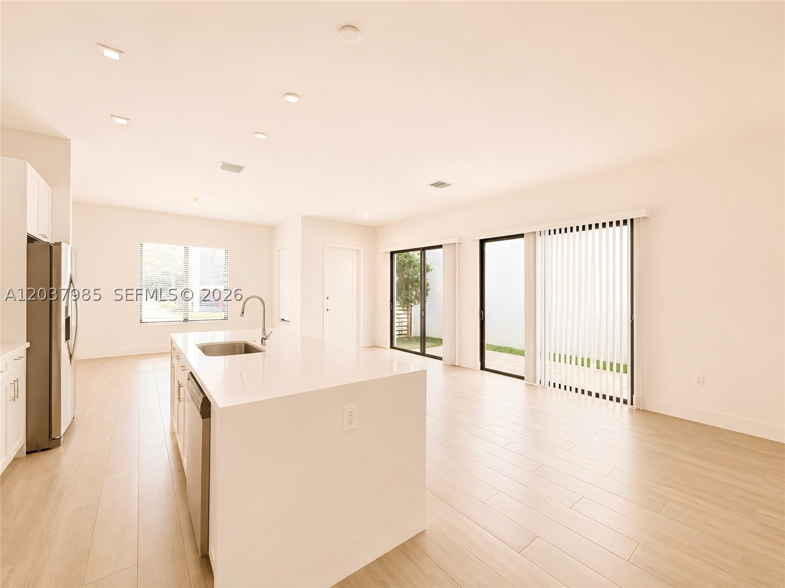 The house features 3 bedrooms, 2.5 bathrooms, a loft, and a 2-car garage. It also includes upgraded wood-look flooring on the first floor, a chef-caliber open kitchen, blackout shades in the bedrooms, and blinds throughout the first floor.