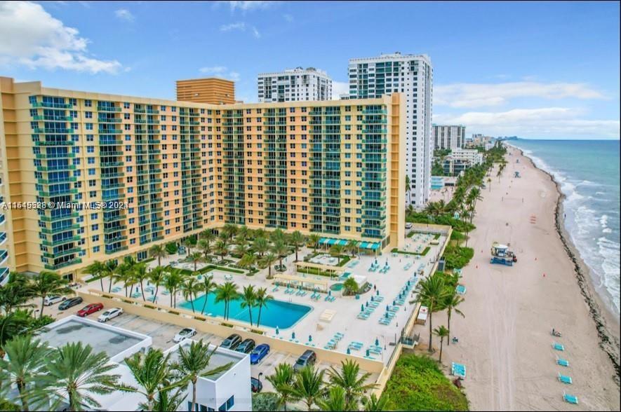 SPECTACULAR CITY VIEWS, TOTALLY REMODELED 1/1/1 IN THE DESIRABLE "THE WAVE "IN HOLLYWOOD. HAS TWO (2) PARKING SPACES, PLUS VALET.   WASHER AND DRYER COMBO INSIDE THE UNIT. WISELY DESIGNED WALL TO WALL CLOSET, IN MASTERROOM. HALF BATH FOR GUESTS, NEXT TO THE LIVING ROOM.   ENJOY RESORT STYLE LIVING WITH GREAT AMENITIES, HEATED POOL, JACUZZI, CAFETERIA, GYM, EXERCISE ROOM, VALET AND MORE.
