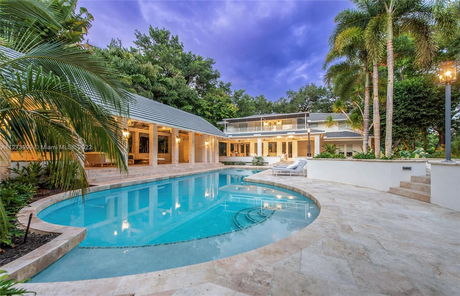 Fall in love with this exquisite Old Cutler garden timeless estate.  Neighboring Fairchild Gardens, this enchanting estate rests on an impressive 7,419 sf/48,503 sf lot. Its captivating lush grounds and massive oak trees makes you feel in your own private retreat. Fully remodeled, this estate features elegant light-filled living spaces with double height ceilings, spacious living/family rooms, chef's kitchen, new marble floors, cozy library, temperature-controlled wine cellar and a stylish bar for those who love to entertain guests. The outdoor spaces feature a massive poolside loggia, extensive terraces for entertaining and optional gate access via exclusive Snapper Creek. In addition, this estate offers a 3-car garage with bonus space for potential gym.